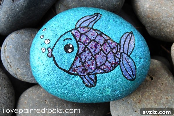 Tiny Treasures: 41 Adorable Rock Painting Ideas 29 Vibrant Fish Painted Rocks, ideal for aquatic decor.