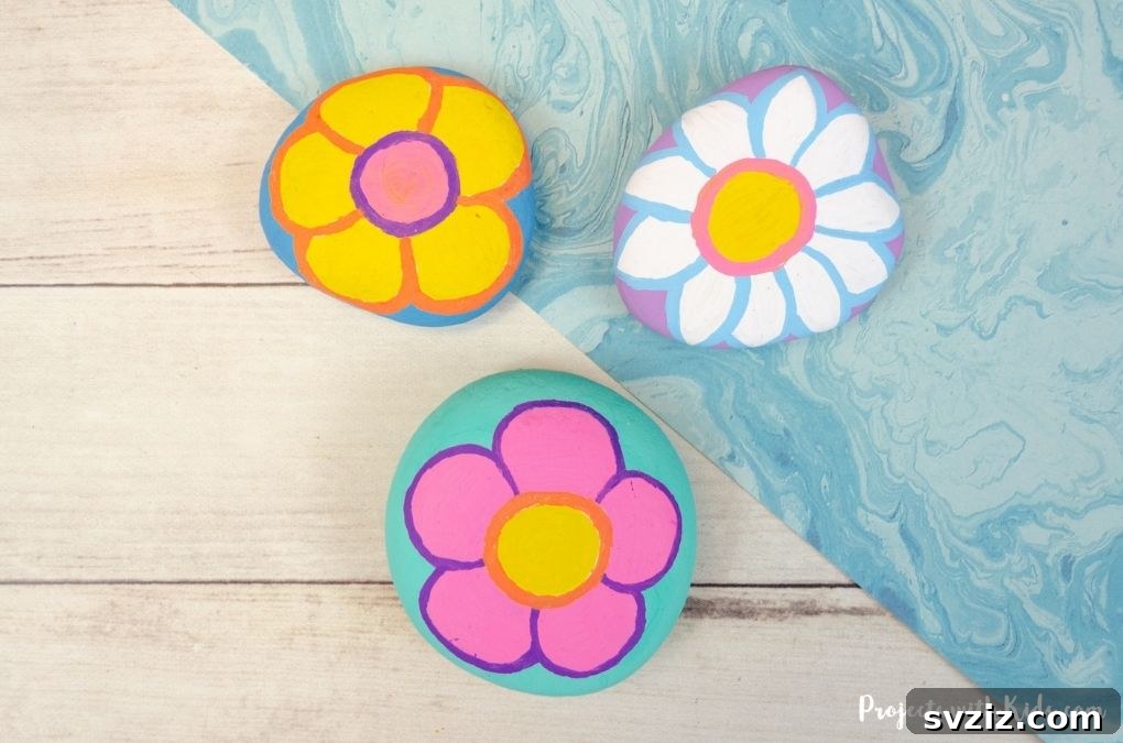 Tiny Treasures: 41 Adorable Rock Painting Ideas 4 Vibrant Flower Painted Rocks for a natural artistic touch.