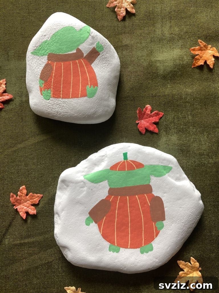 Tiny Treasures: 41 Adorable Rock Painting Ideas 32 Adorable Baby Yoda Rock Art, perfect for Star Wars fans.