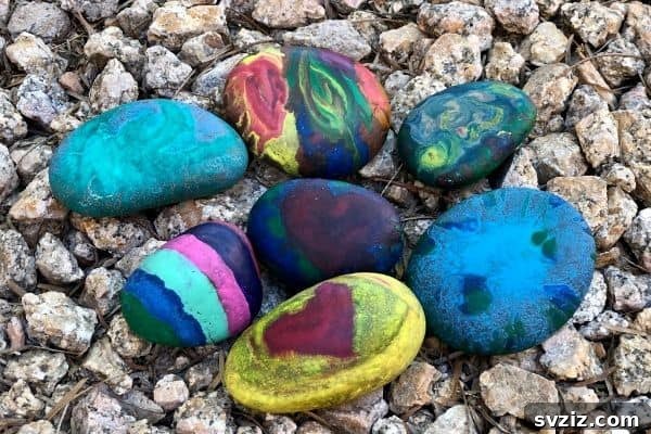 Tiny Treasures: 41 Adorable Rock Painting Ideas 35 Abstract Melted Crayon Rocks, a vibrant and tactile craft.