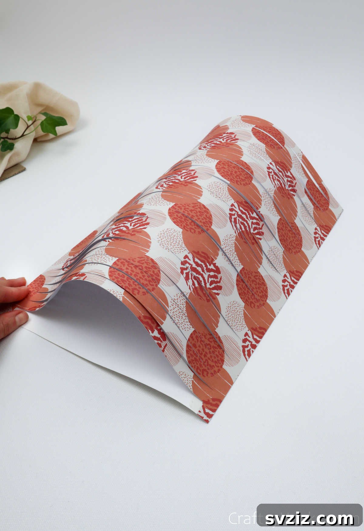 Craft Your Own Stunning Paper Lanterns 14 The craft paper, attached to the white lining, begins to naturally bend and billow, forming the iconic lantern shape.