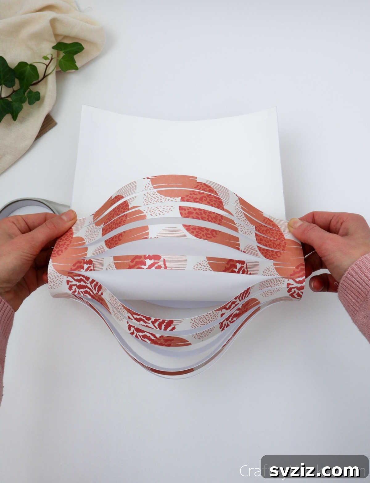 Craft Your Own Stunning Paper Lanterns 17 The paper is fully curled and the ends are joined to create the round, three-dimensional form of the lantern.