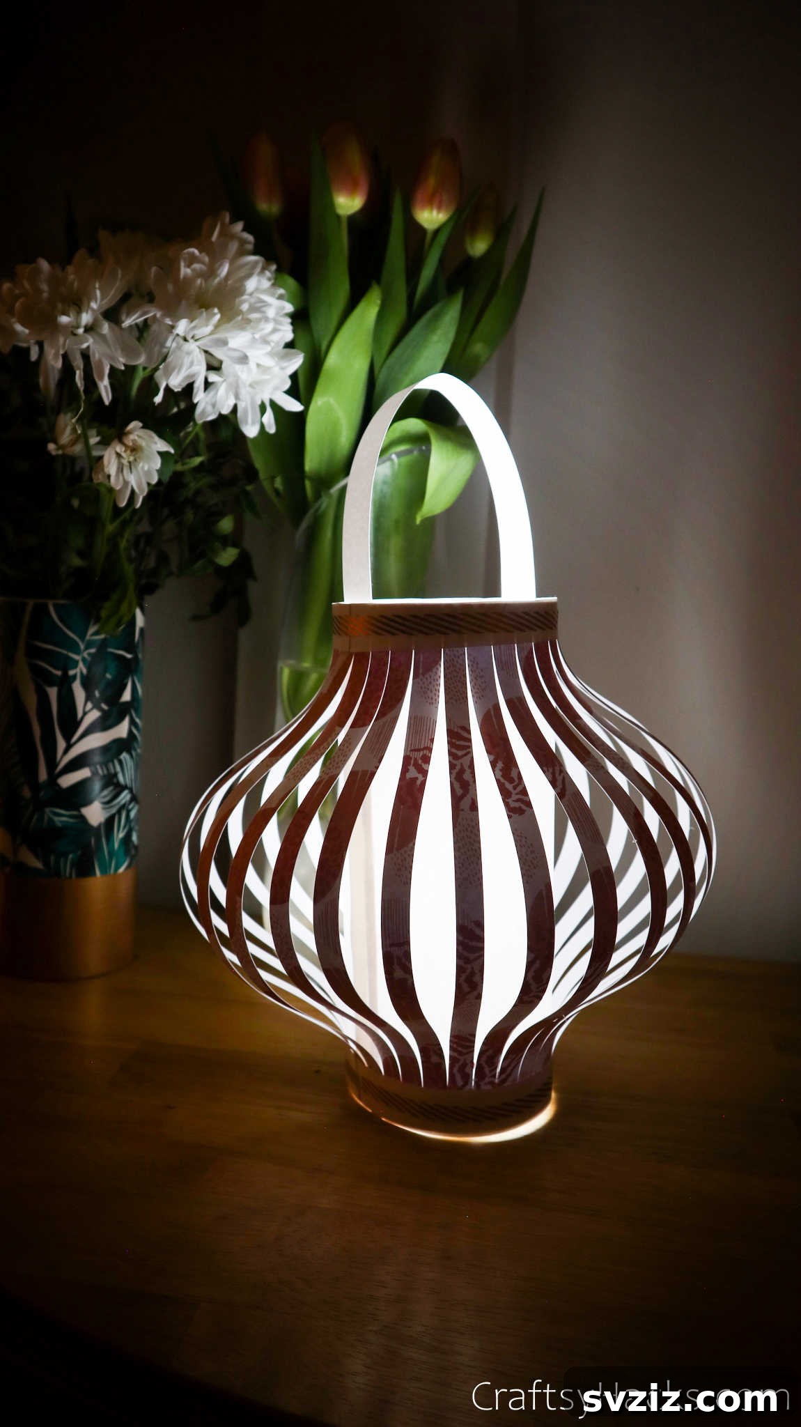 Craft Your Own Stunning Paper Lanterns 4 A single glowing paper lantern casting warm light in a dimly lit setting, showcasing its potential as captivating home decor.