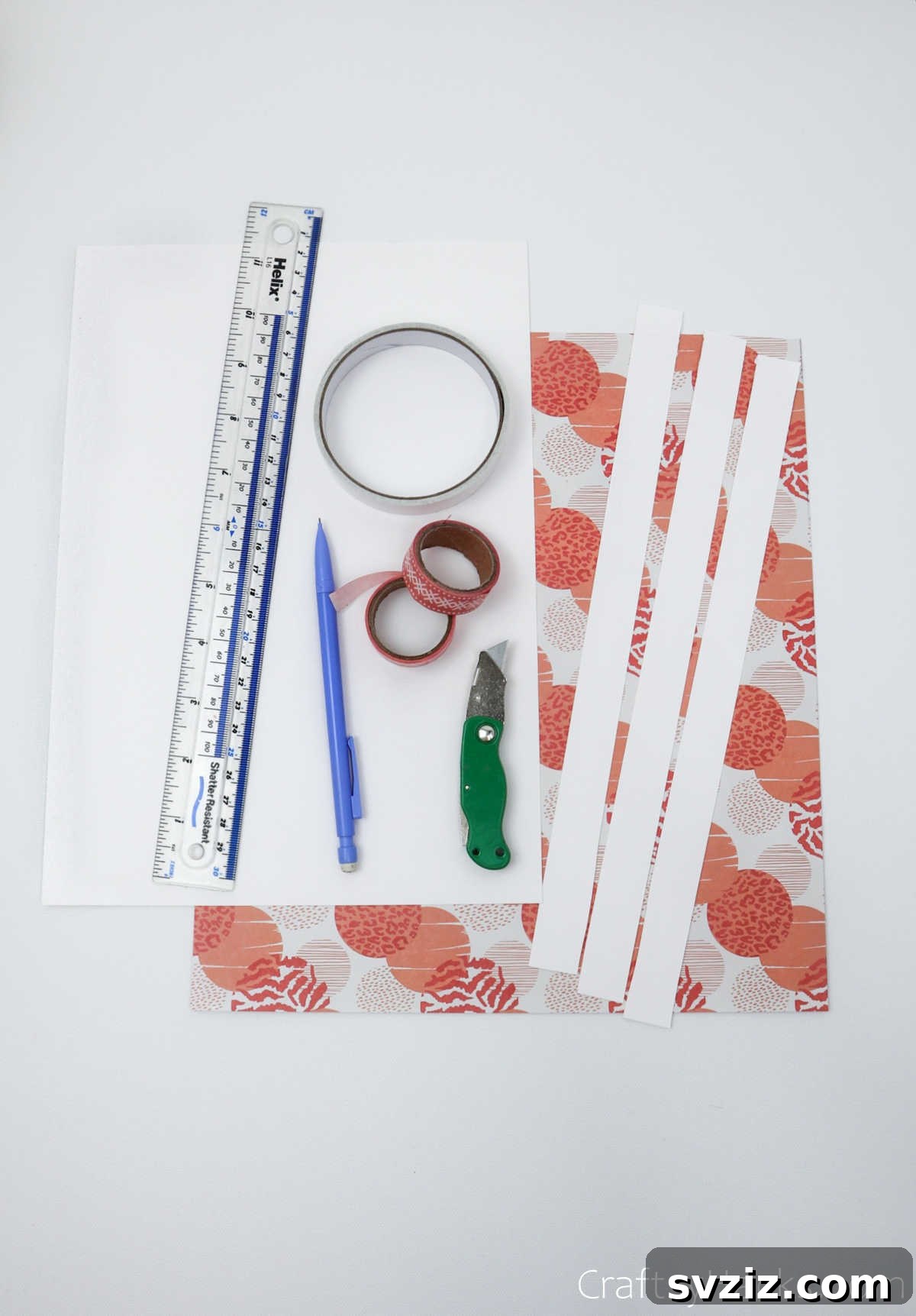 Craft Your Own Stunning Paper Lanterns 5 Close-up of essential craft supplies including colorful paper, ruler, pencil, and tape, laid out for a DIY lantern project.