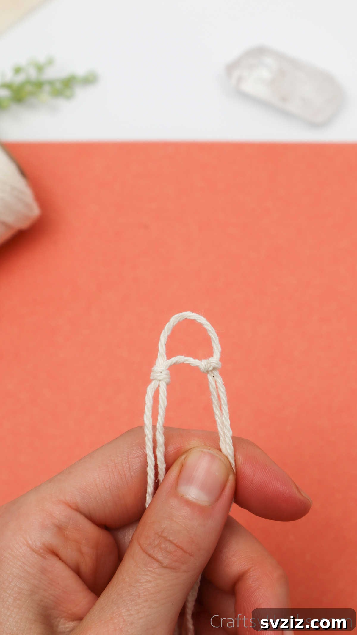 Simple Stone Necklace DIY Guide 20 The two connected knots, showing the intended spacing for the third knot to complete the triangular base