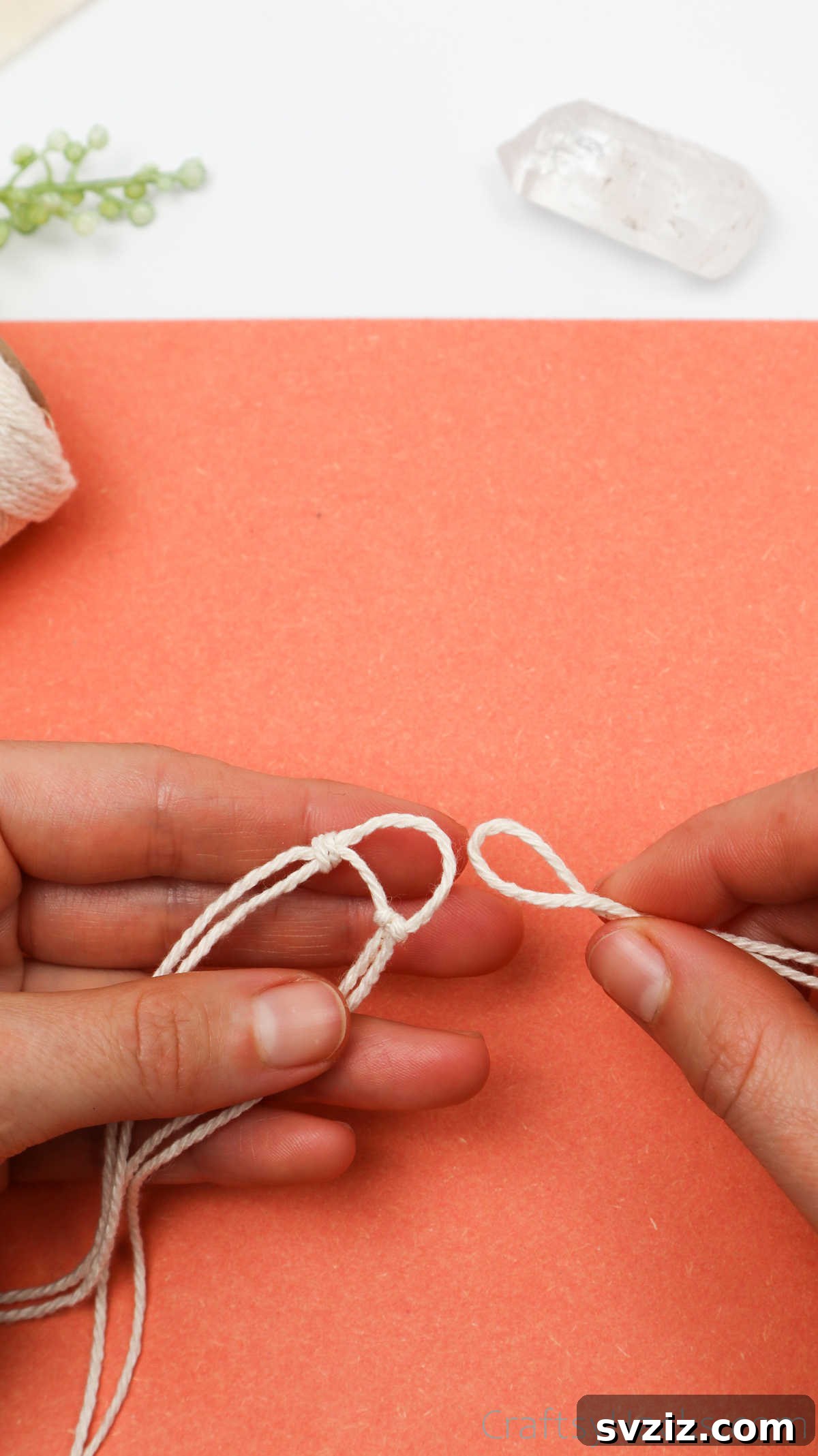 Simple Stone Necklace DIY Guide 21 The third cord being added and knotted, completing the initial triangular base for the crystal
