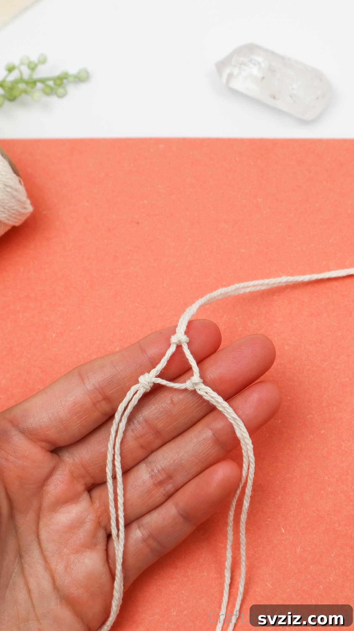 Simple Stone Necklace DIY Guide 22 The completed triangular base formed by three evenly spaced knots, ready to hold the crystal