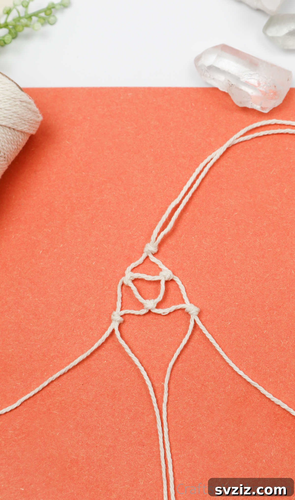 Simple Stone Necklace DIY Guide 30 Close-up of the macrame net forming around the crystal, showcasing the intricate knotwork