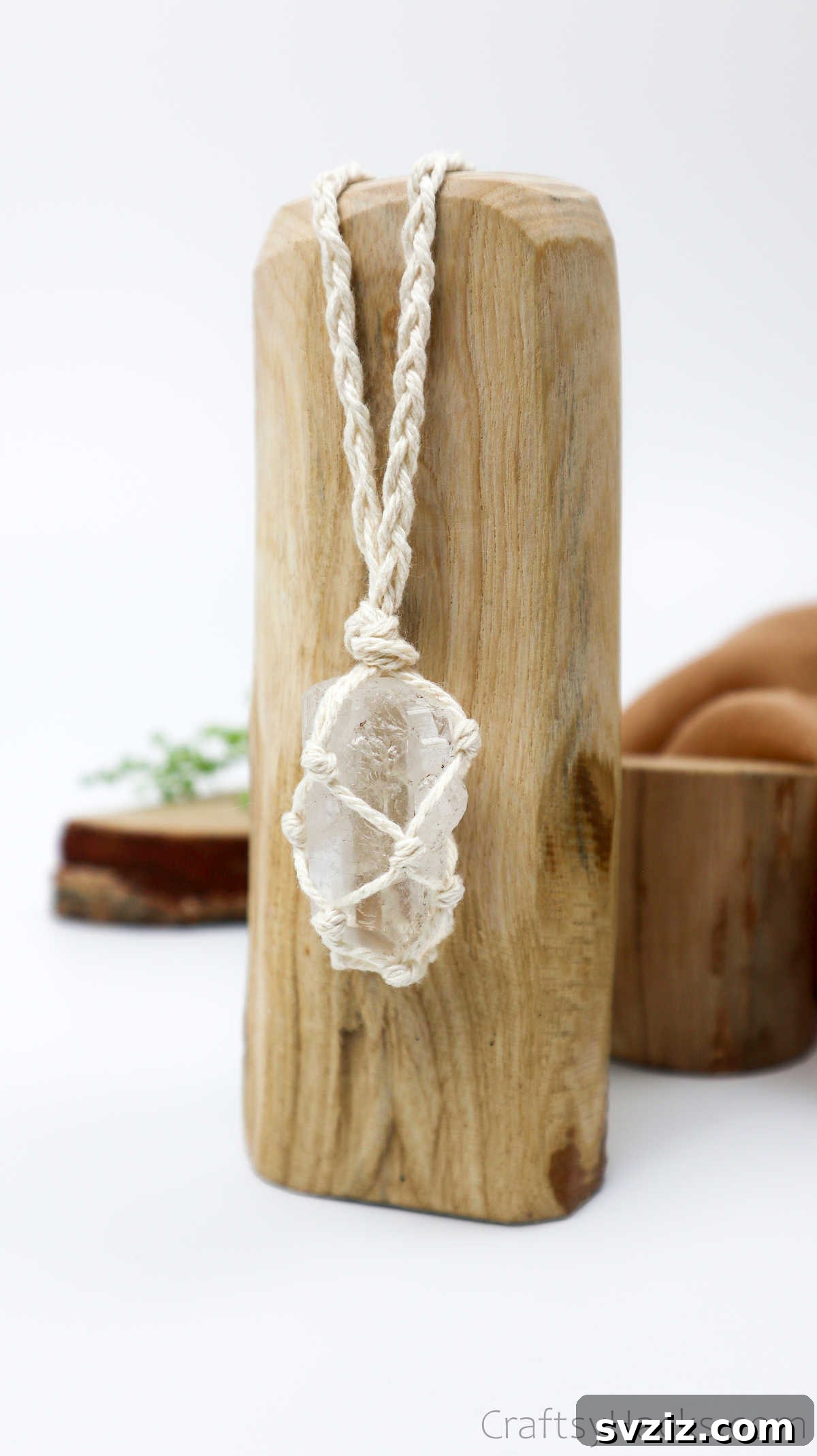 Simple Stone Necklace DIY Guide 4 A finished DIY macrame necklace with a crystal pendant displayed aesthetically
