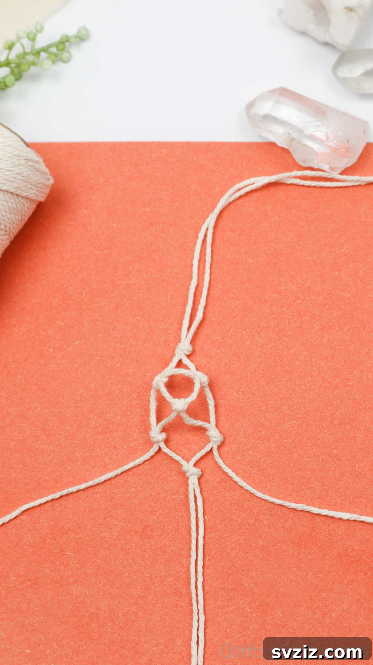 Simple Stone Necklace DIY Guide 31 The macrame netting covering more of the crystal, illustrating the upward progression of the design