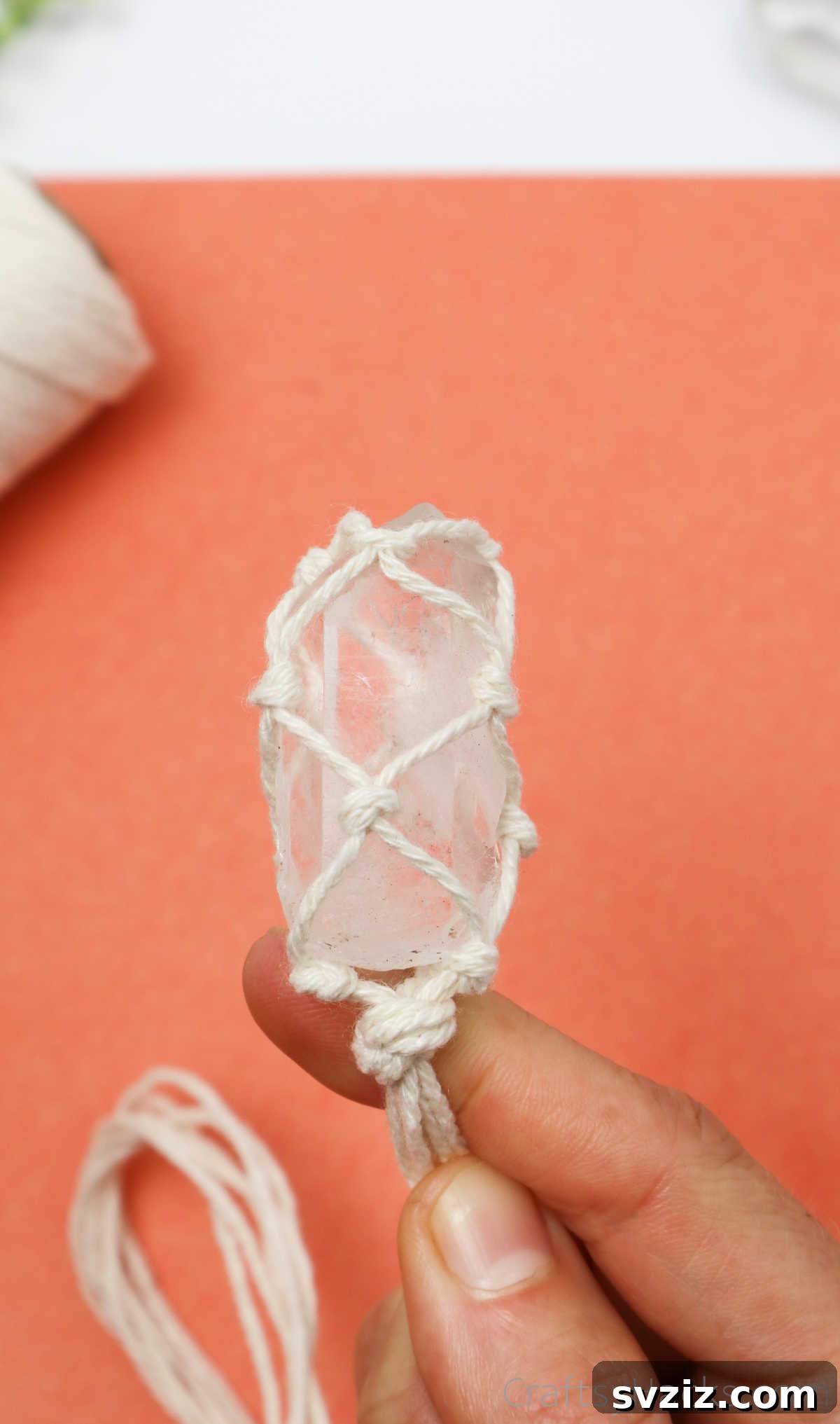 Simple Stone Necklace DIY Guide 37 The top knot tightened and pushed down to secure the crystal within the macrame netting