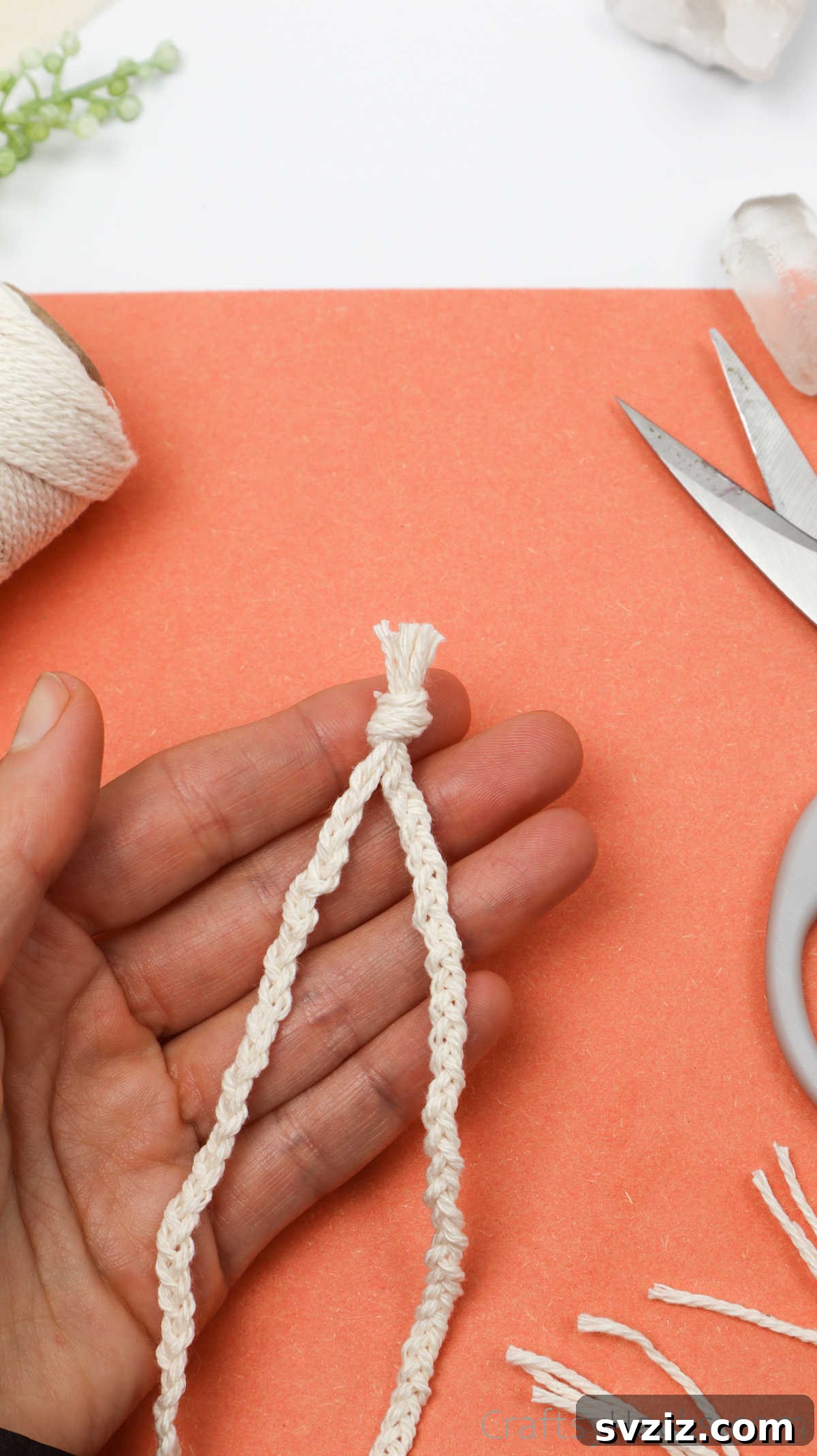 Simple Stone Necklace DIY Guide 41 A close-up of the finished end of the macrame necklace, showing the final knot and trimmed cords