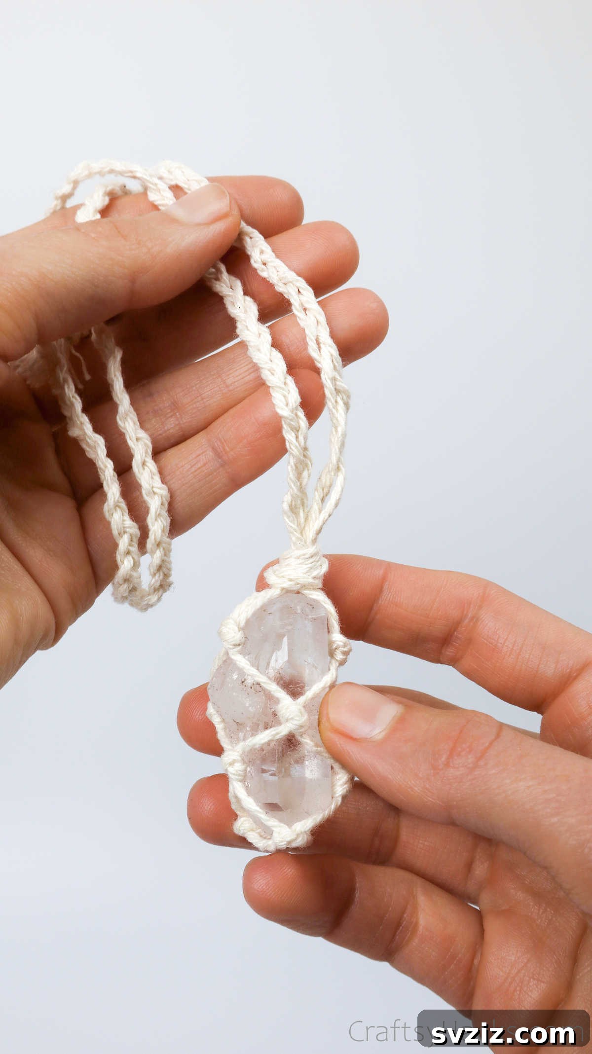 Simple Stone Necklace DIY Guide 43 A hand holding a finished DIY macrame necklace, highlighting its appeal for all ages