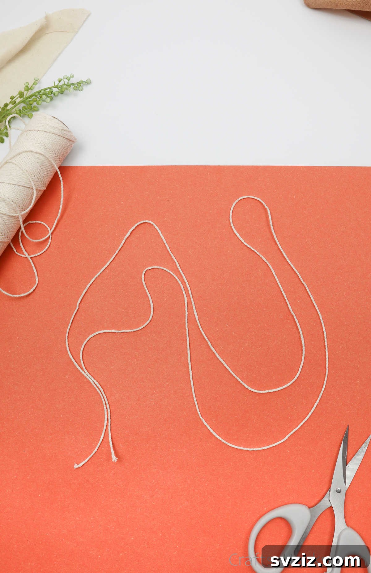 Simple Stone Necklace DIY Guide 7 A single piece of cotton twine folded neatly in half, forming a loop