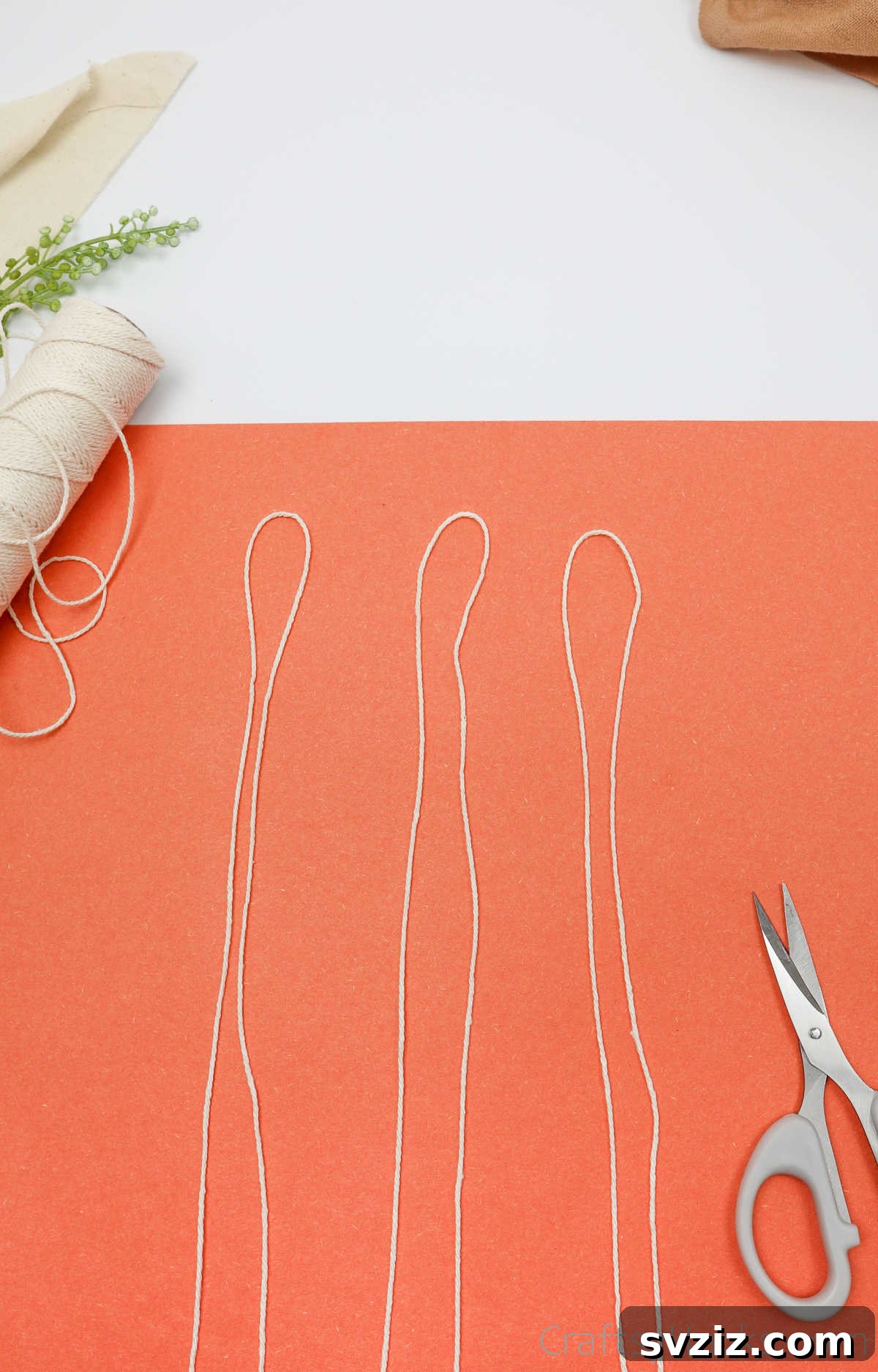 Simple Stone Necklace DIY Guide 8 Three identical pieces of cotton twine, each folded in half, laid out side by side