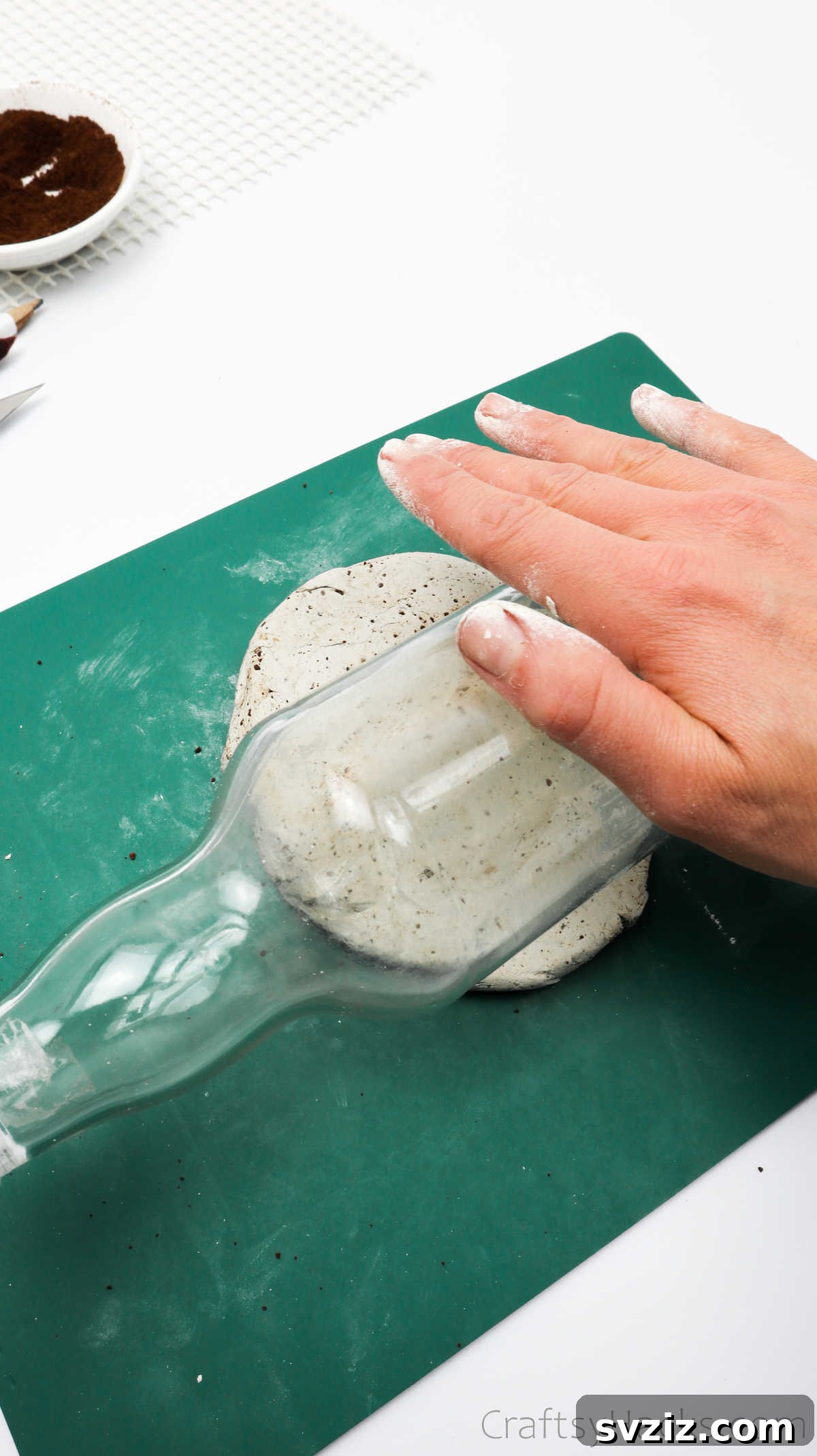 Rolling Out Clay with a Glass Bottle