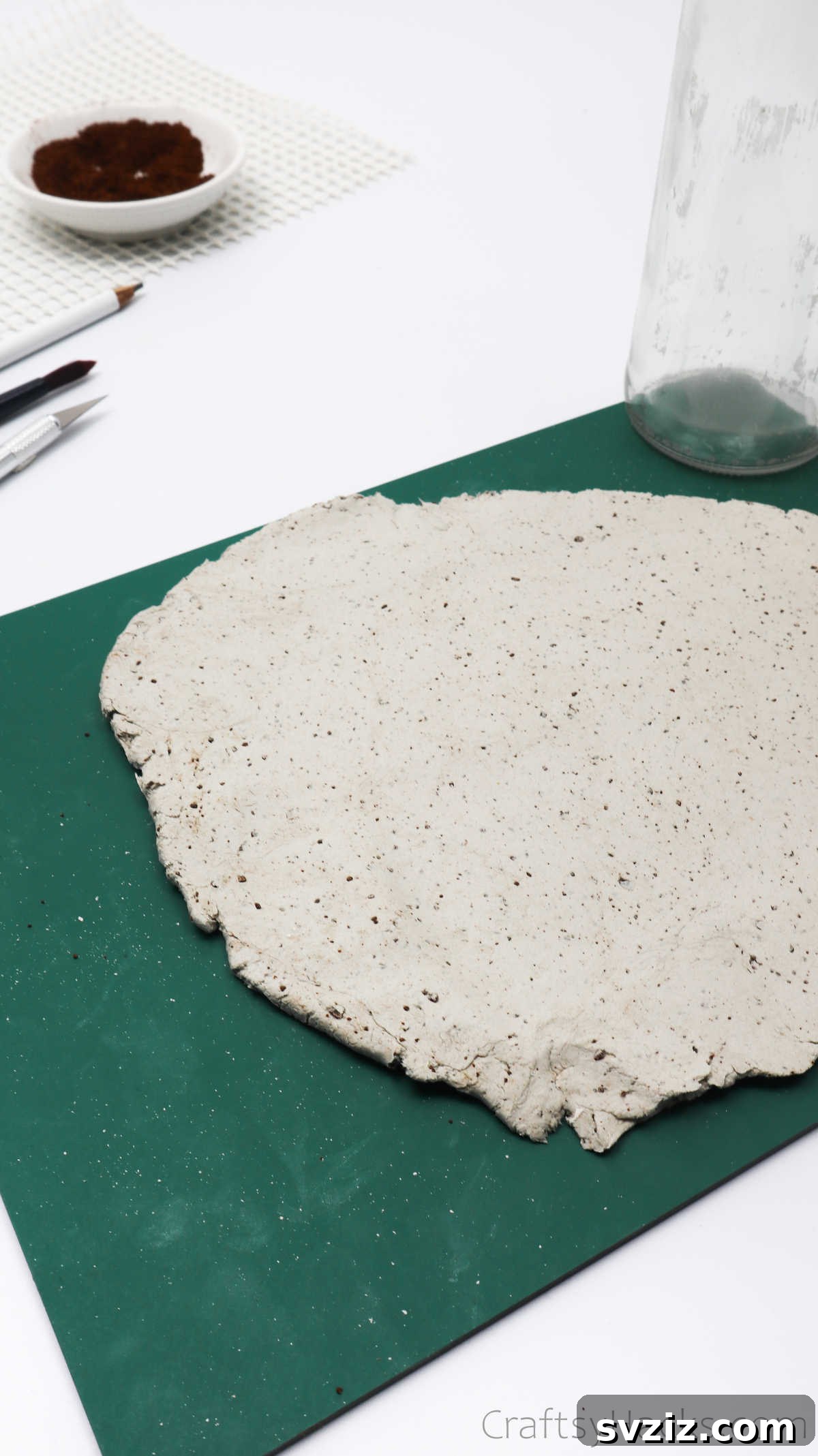 Checking Rolled Out Clay Size Against Bottle
