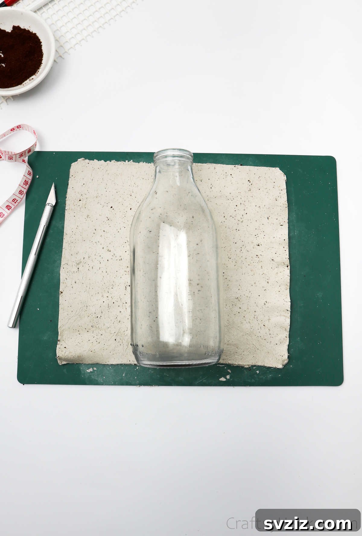 Bottle Placed on Cut Clay Sheet for Size Check