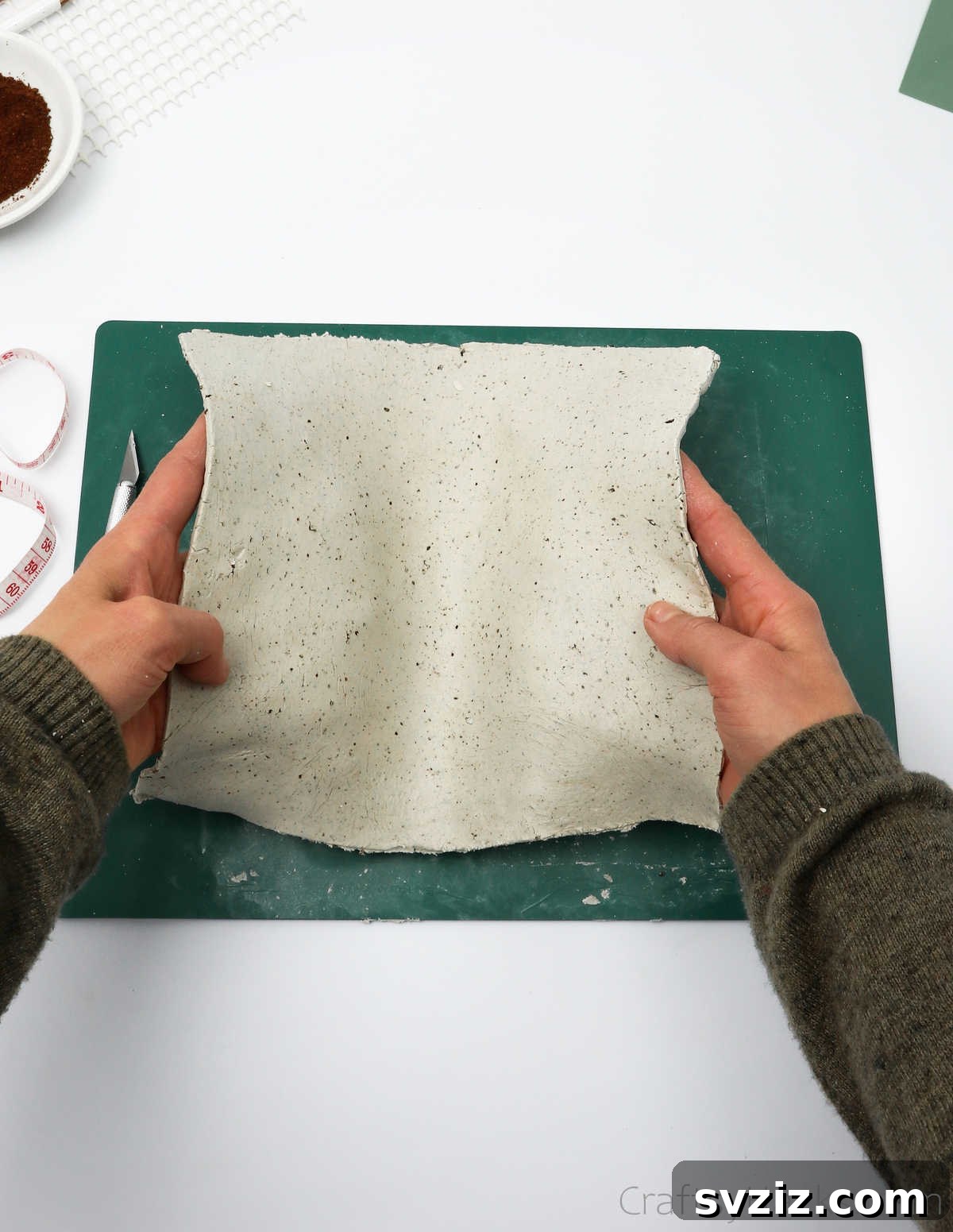 Holding Air Dry Clay Sheet Before Wrapping Bottle