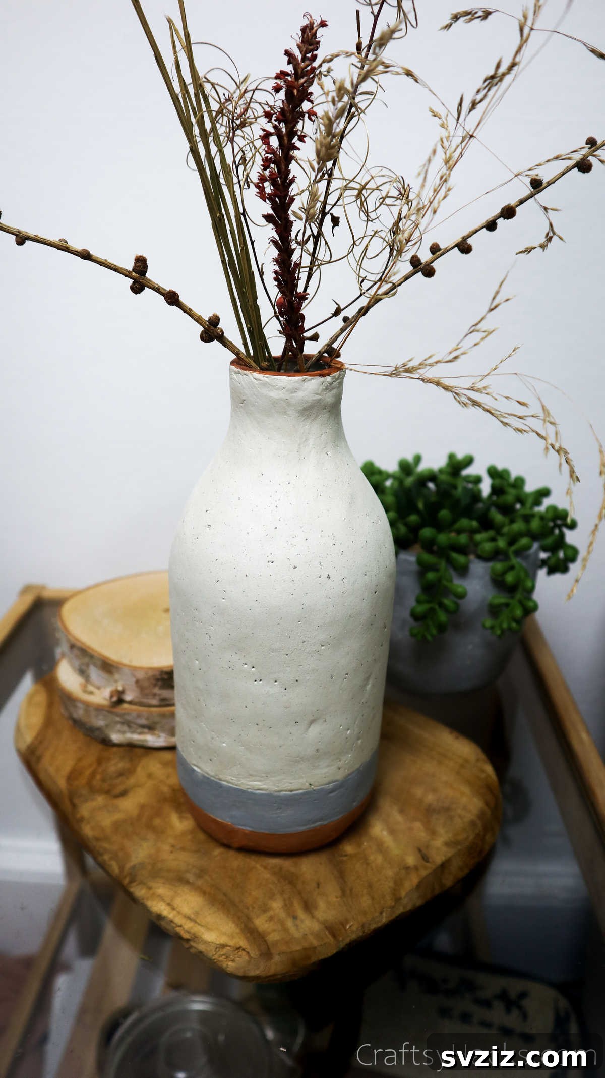 Elegant Clay Bottle Vase on a Stool
