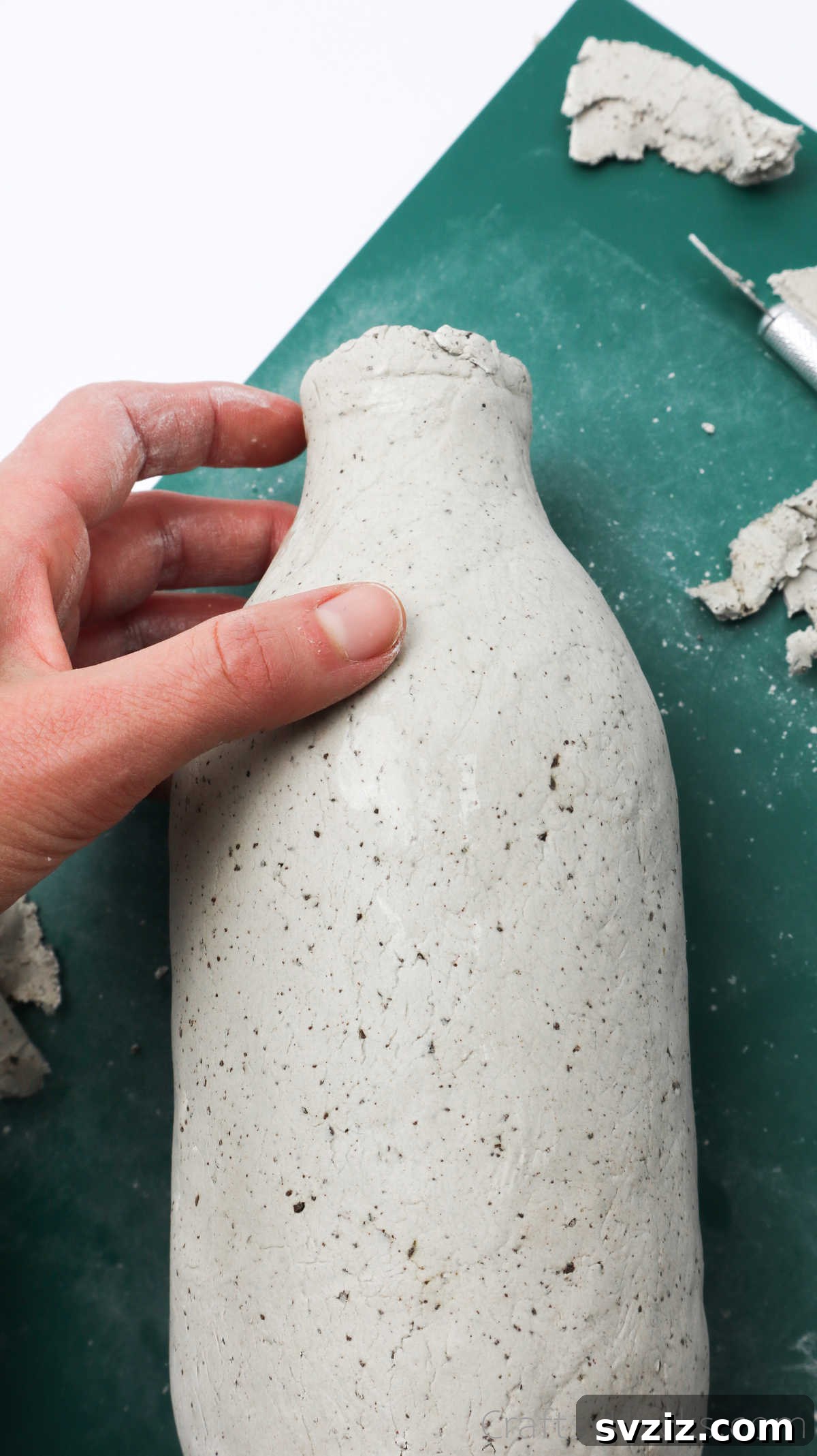 Fully Clay-Covered Bottle Ready for Bottom