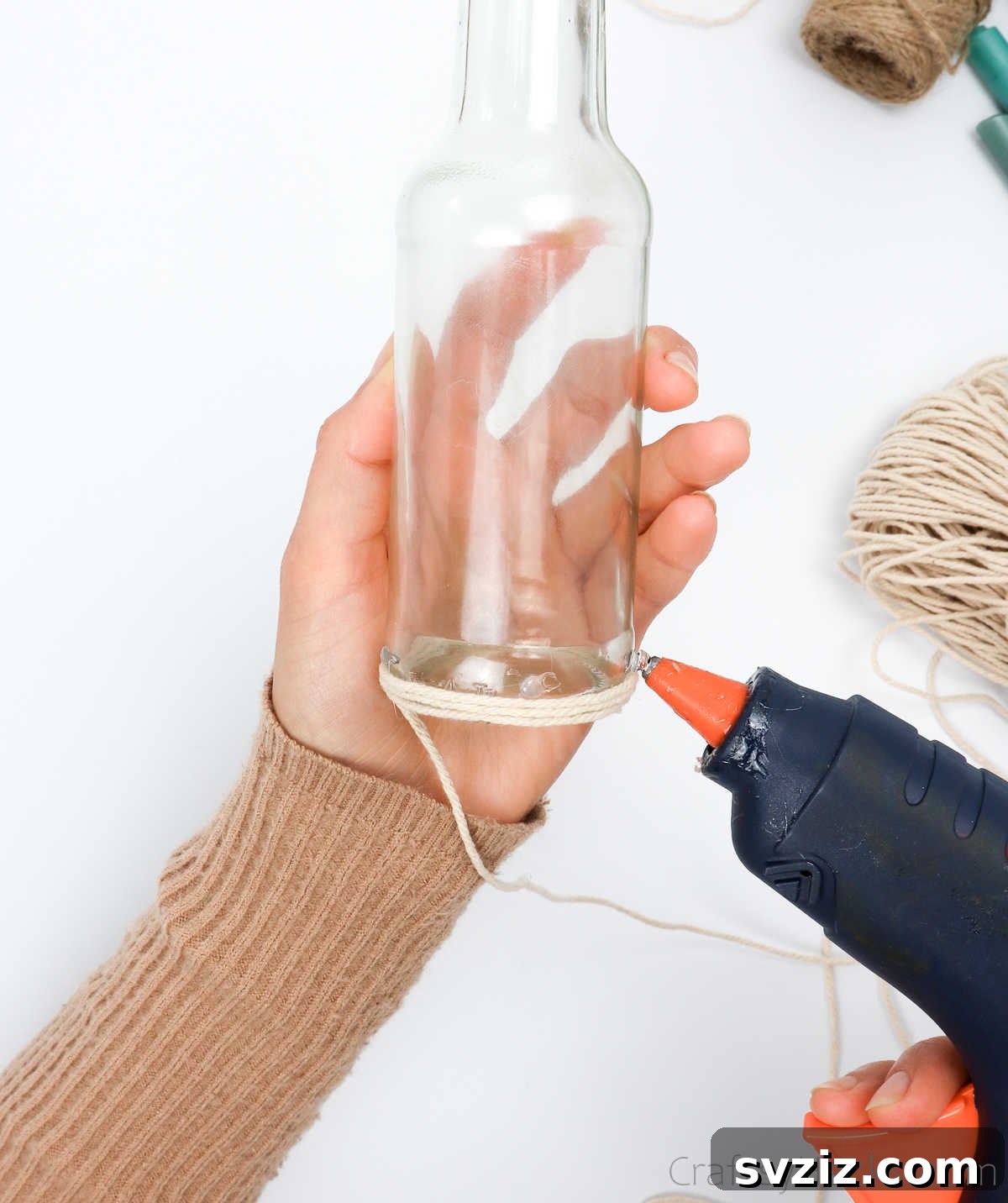 Applying Glue to Continue String Wrapping on Bottle