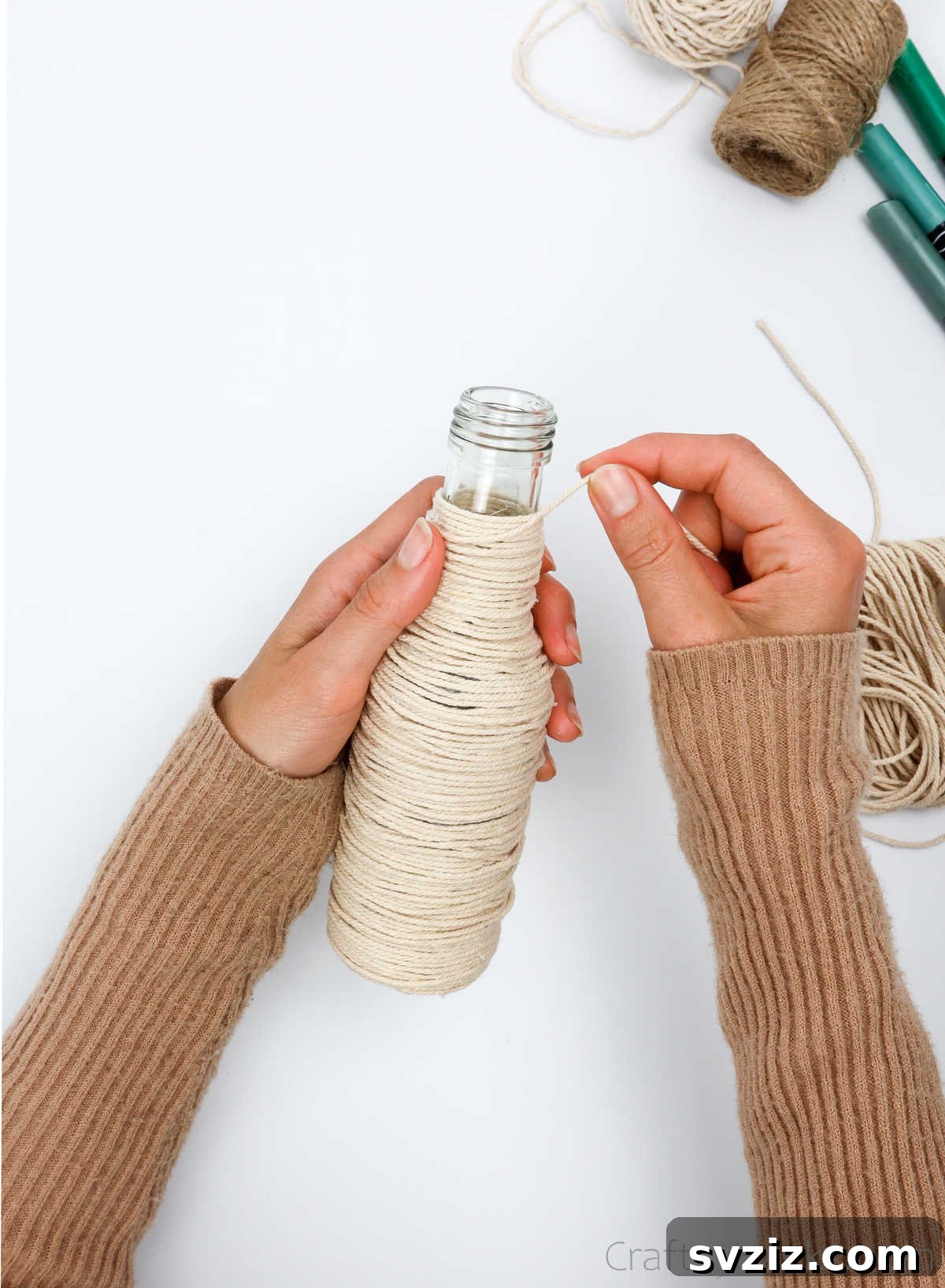 Securing the End of the String Wrap at the Bottle Top
