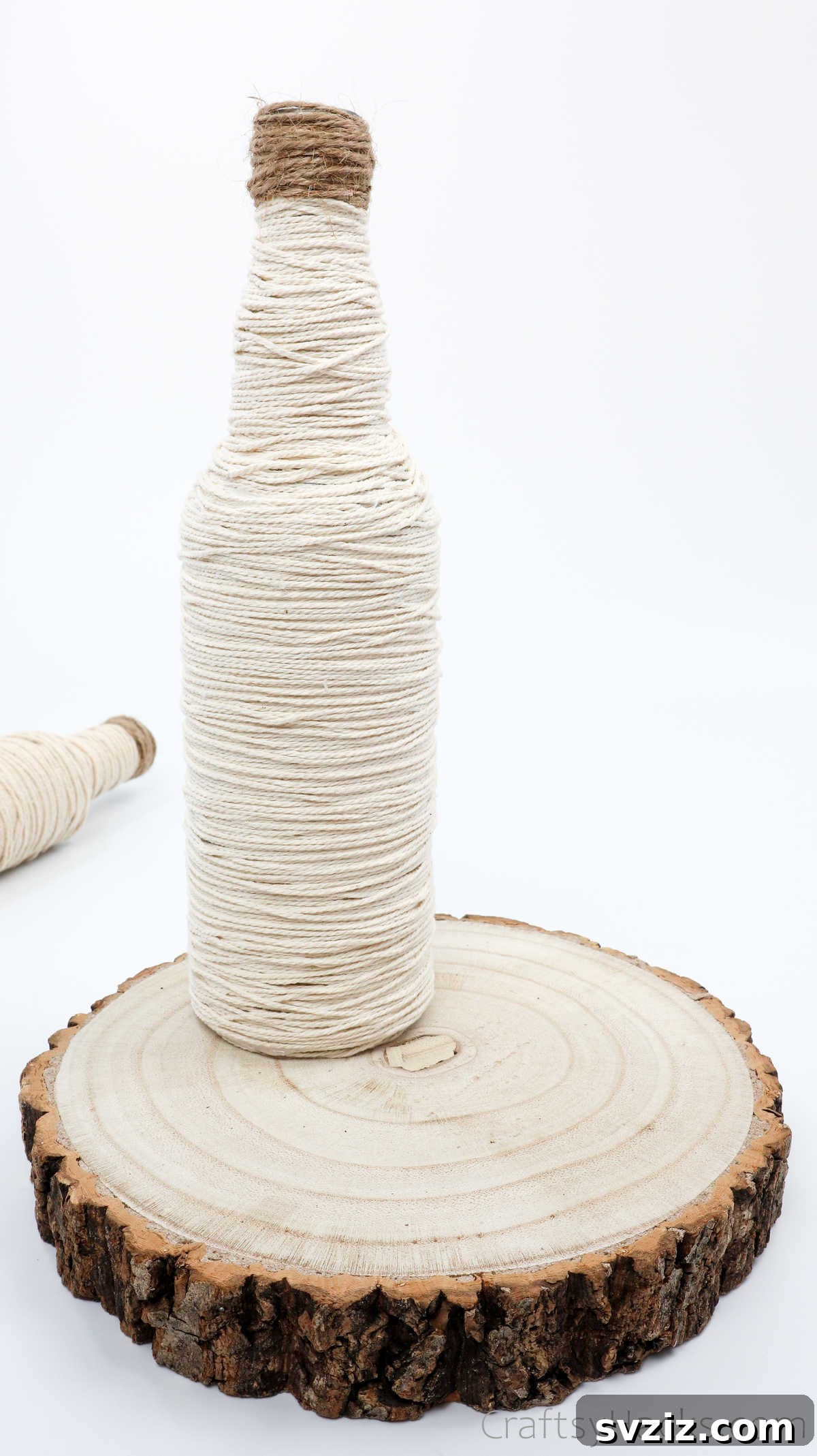 Placing a Wrapped Bottle on the Wood Slice Base