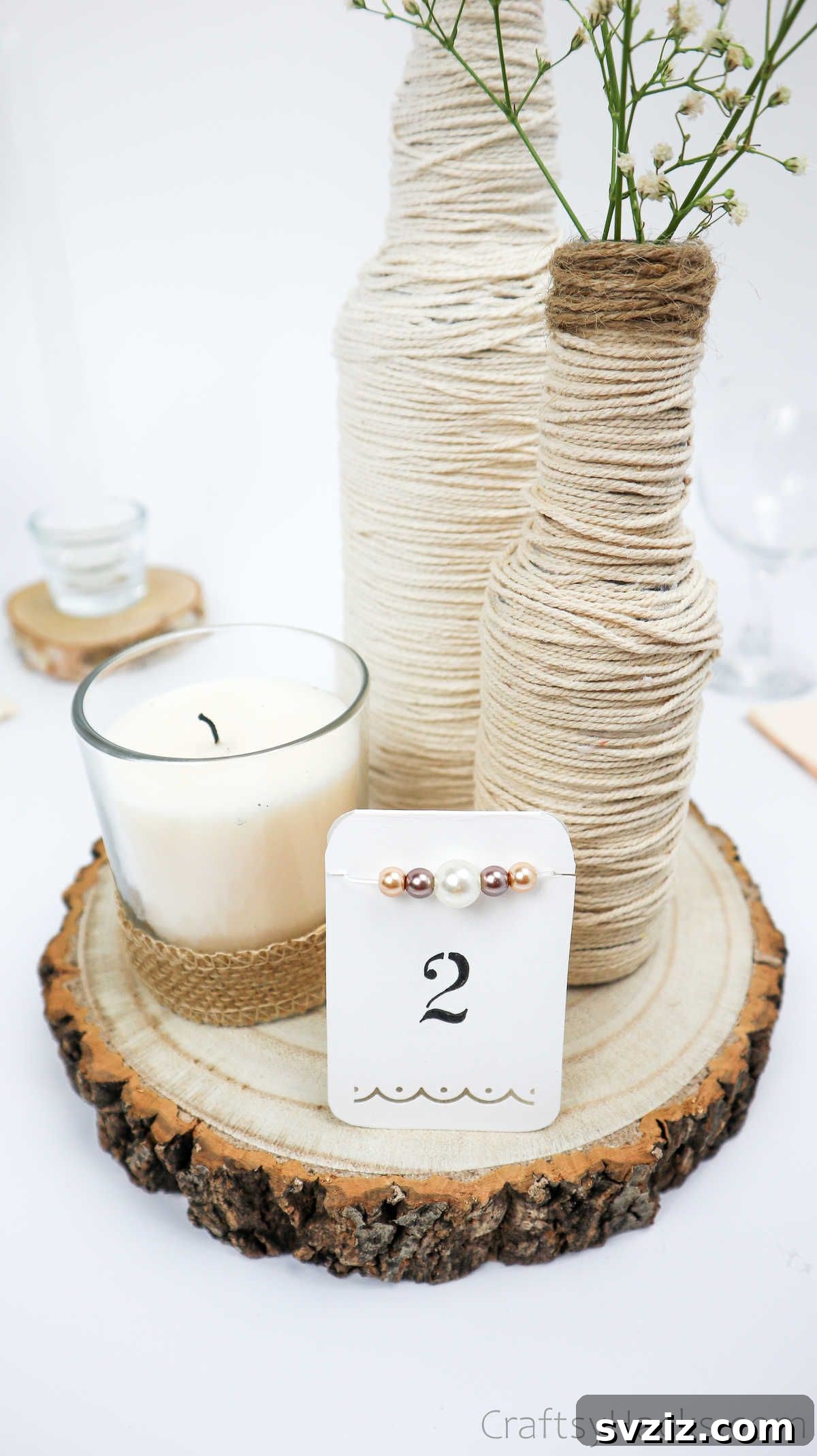 Bottle Centerpiece Featuring Candle and Rope Detailing