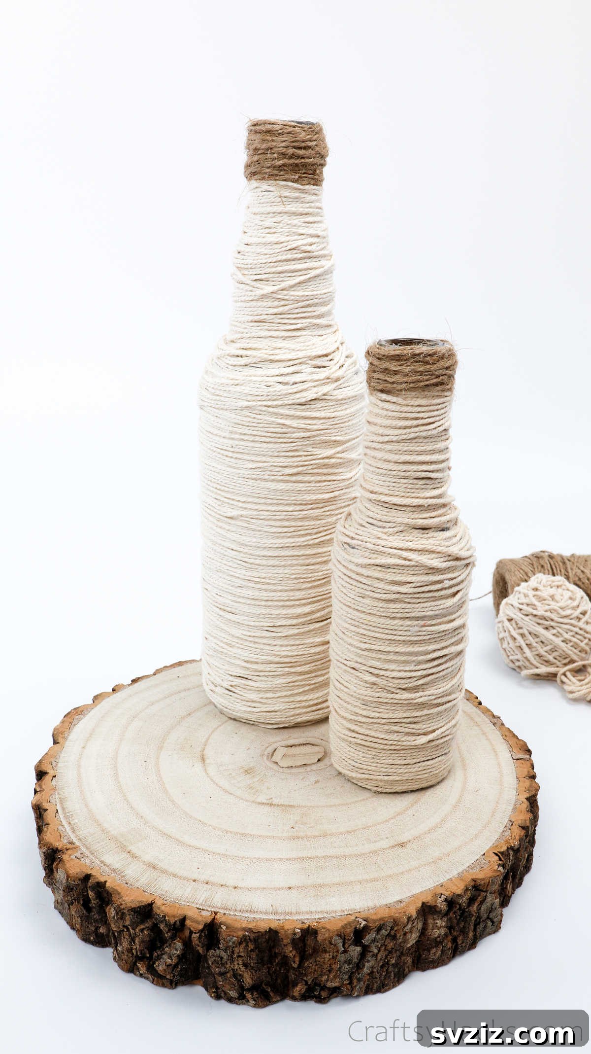 Two Wrapped Bottles Glued to a Wooden Base