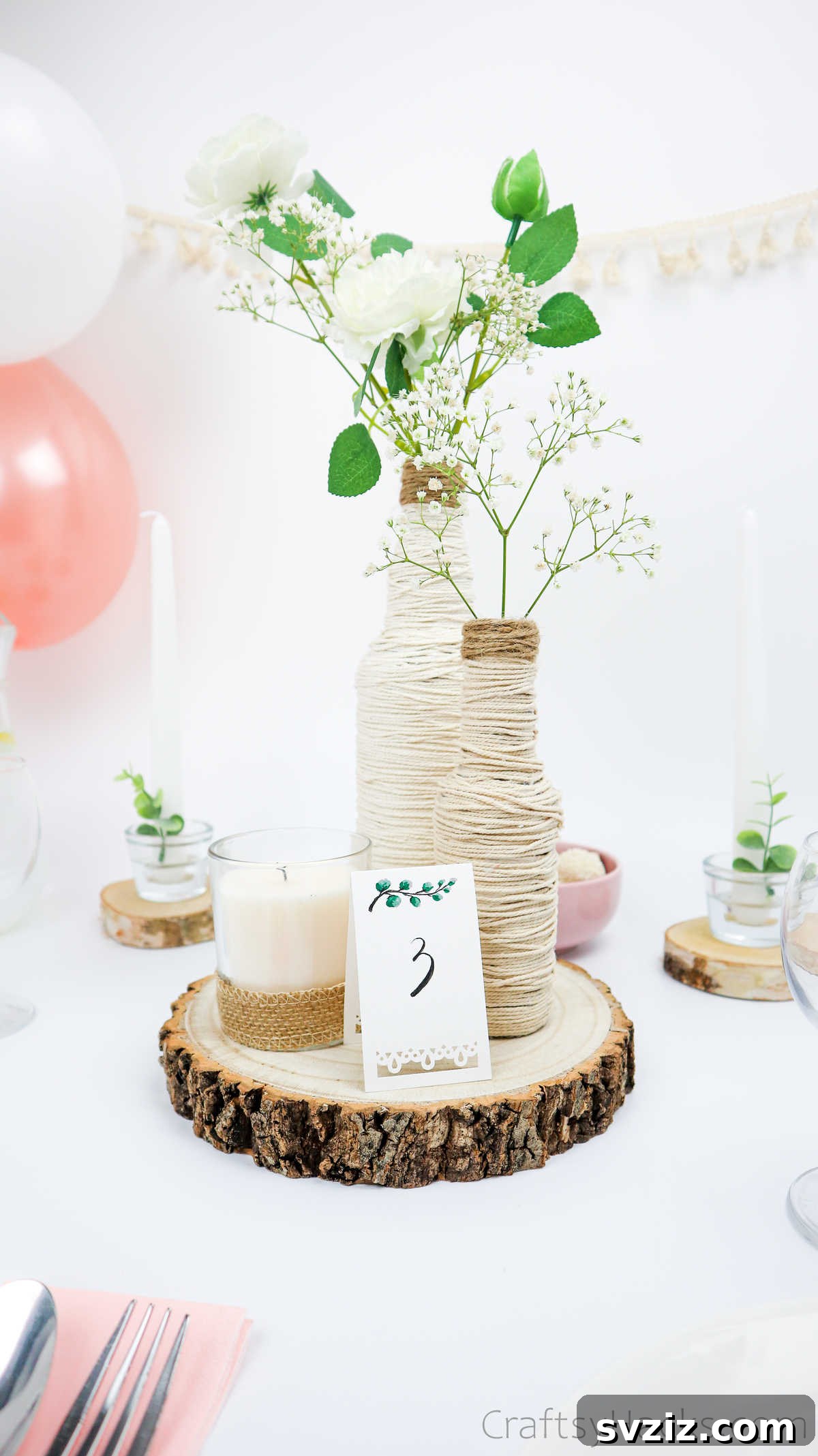 Wedding Centerpiece with Wrapped Bottles and Flowers