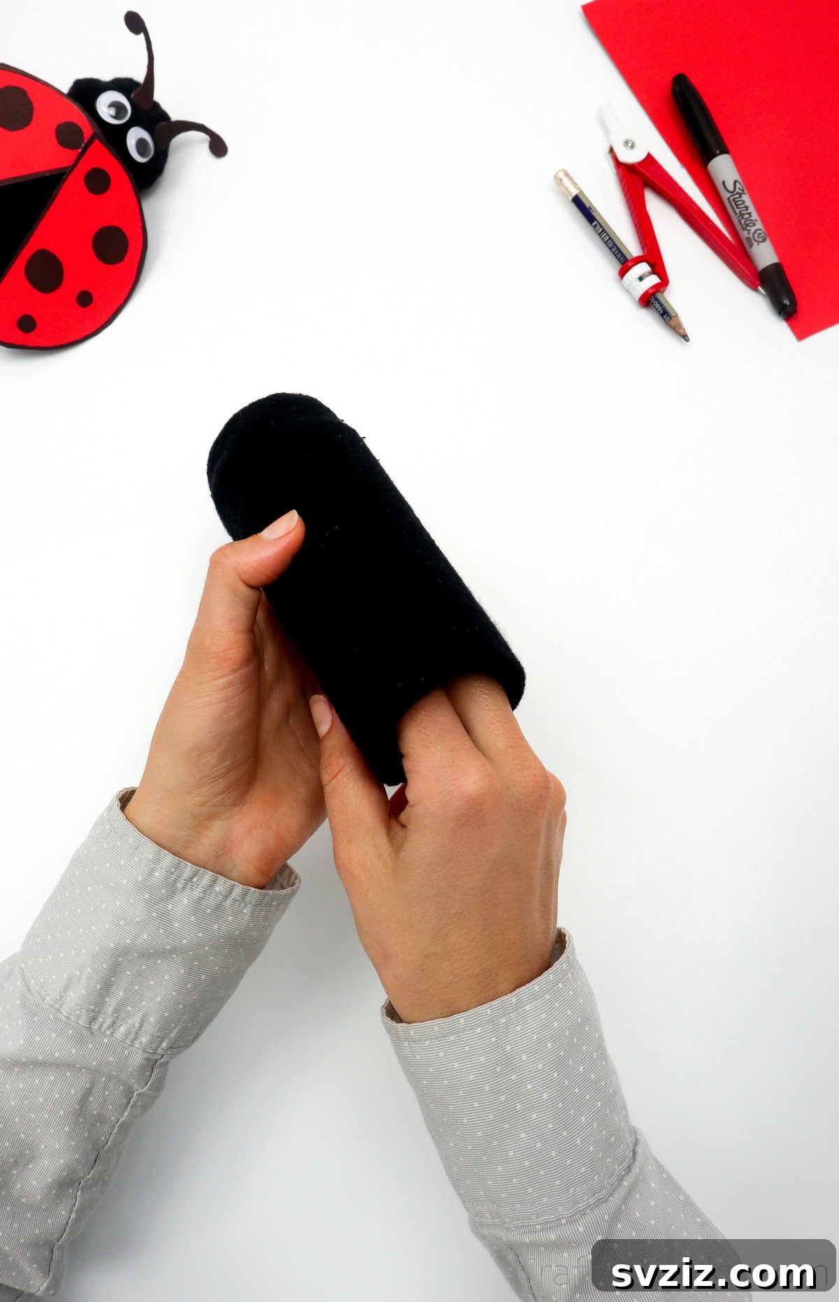 DIY Cardboard Tube Ladybugs 11 tucking paper roll in sock