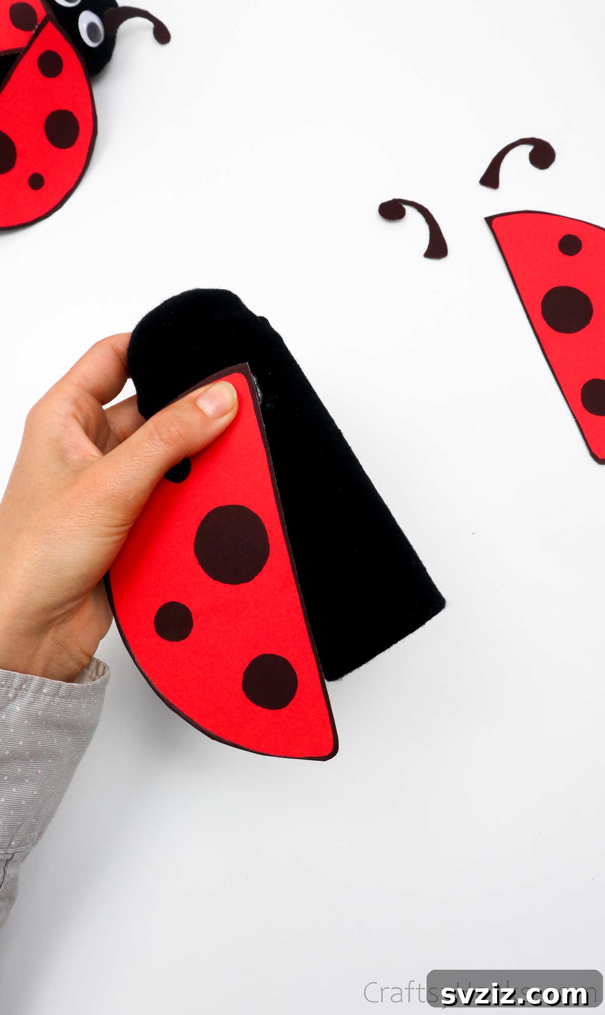 DIY Cardboard Tube Ladybugs 24 glueing wings to ladybug body