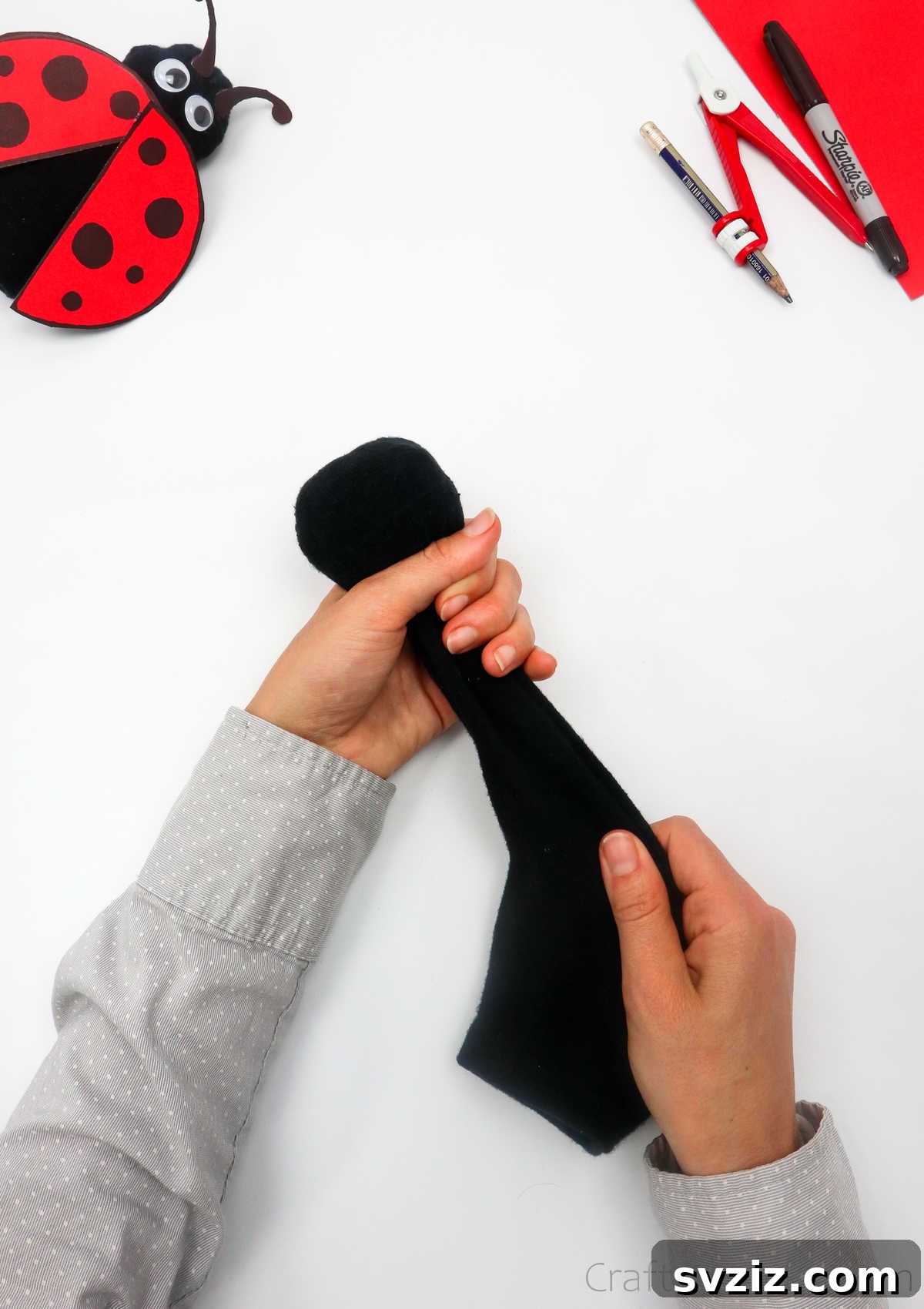 DIY Cardboard Tube Ladybugs 9 creating sock ball