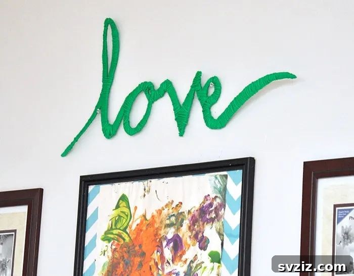 40+ Fun Cardboard Crafts for the Whole Family 39 Easy Wrapped Yarn Wall Art with Cardboard