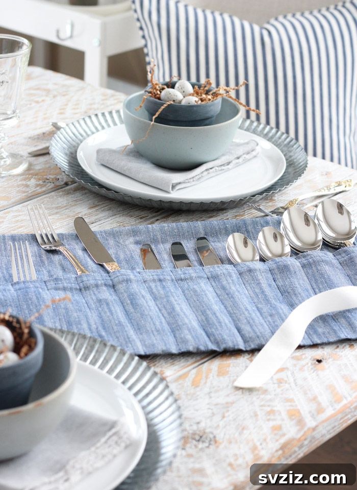 Effortless Stitching: 47 Projects for Every Skill Level 18 A rolled tea towel holder displaying cutlery, secured with a ribbon, ready for elegant table settings.