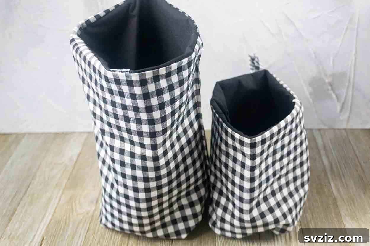 Effortless Stitching: 47 Projects for Every Skill Level 7 Two neatly sewn fabric hanging storage baskets, one with floral print and another with a polka dot pattern, filled with small items.