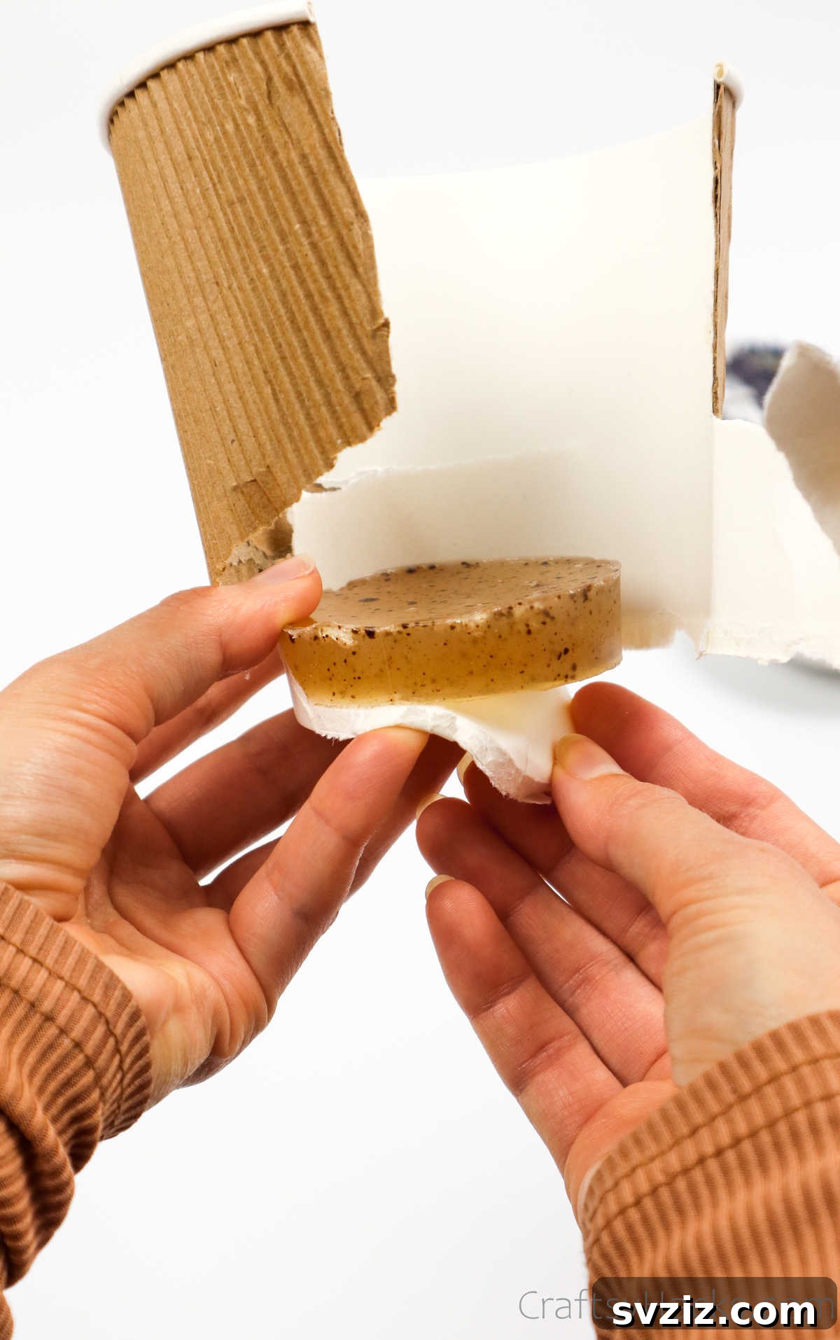 Your Guide to Crafting Homemade Soap 23 Unmolding a round soap bar from a plastic container