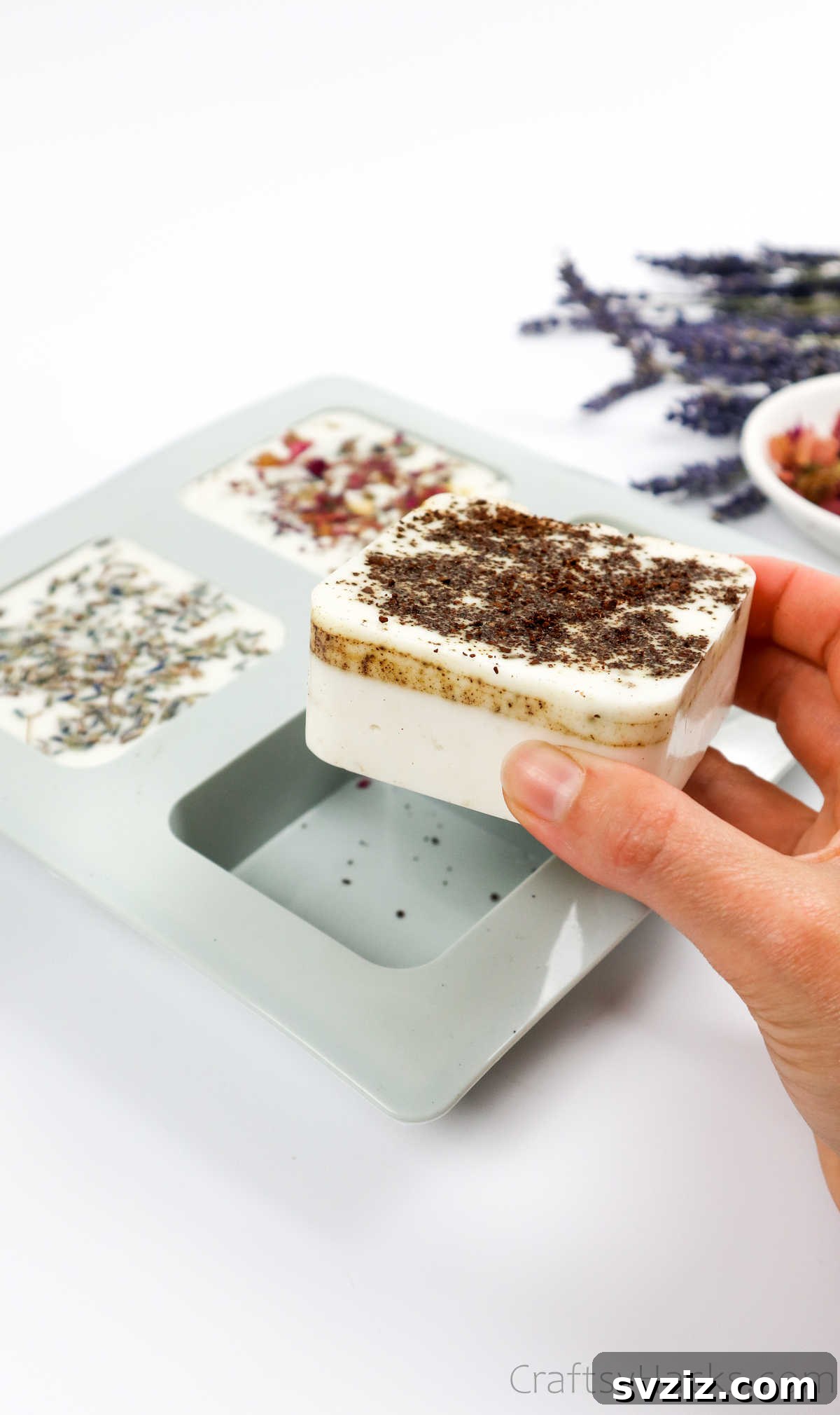 Your Guide to Crafting Homemade Soap 24 Holding a freshly unmolded homemade soap bar