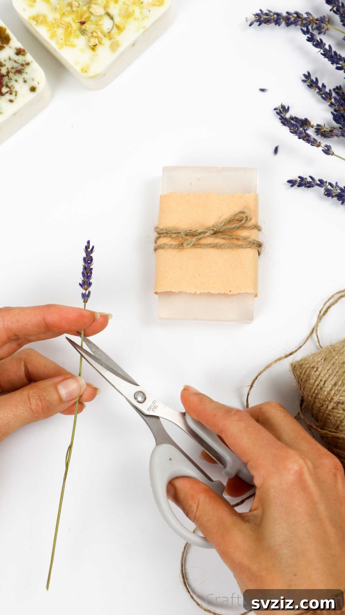 Your Guide to Crafting Homemade Soap 28 Trimming a dried flower stem to adorn a packaged soap
