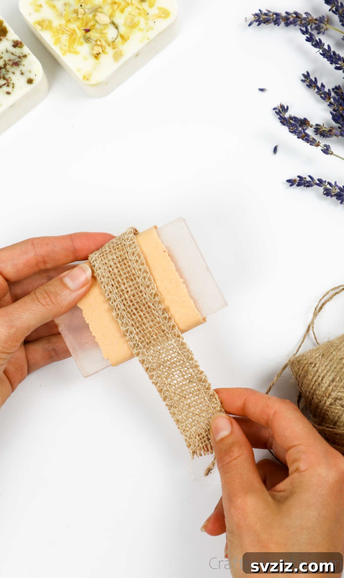 Your Guide to Crafting Homemade Soap 30 Wrapping a soap bar in patterned fabric for a unique gift presentation