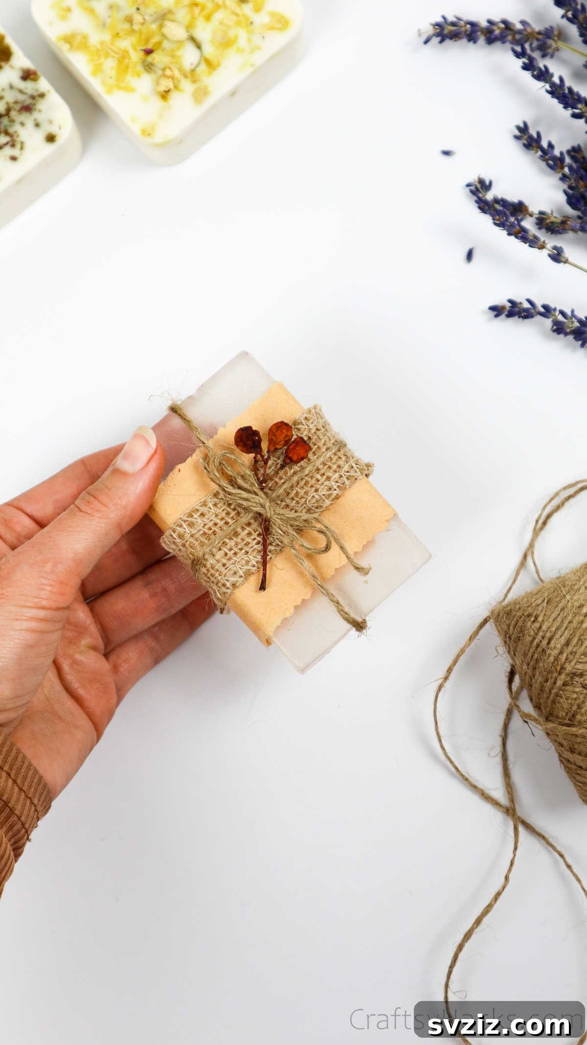 Your Guide to Crafting Homemade Soap 31 A beautifully wrapped soap bar with a dried flower and string detail