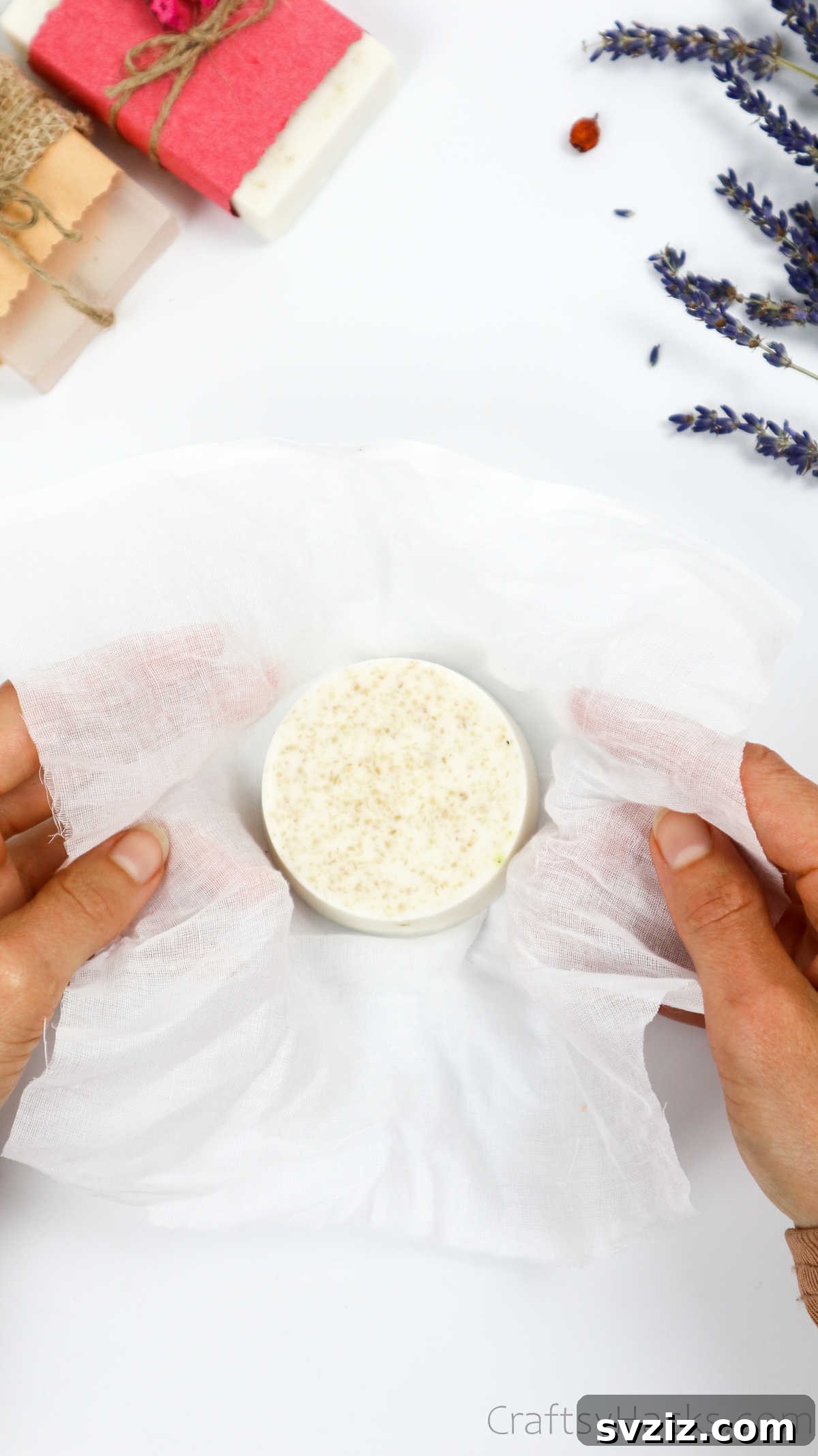 Your Guide to Crafting Homemade Soap 32 Round soap wrapped elegantly in cheesecloth with a natural finish