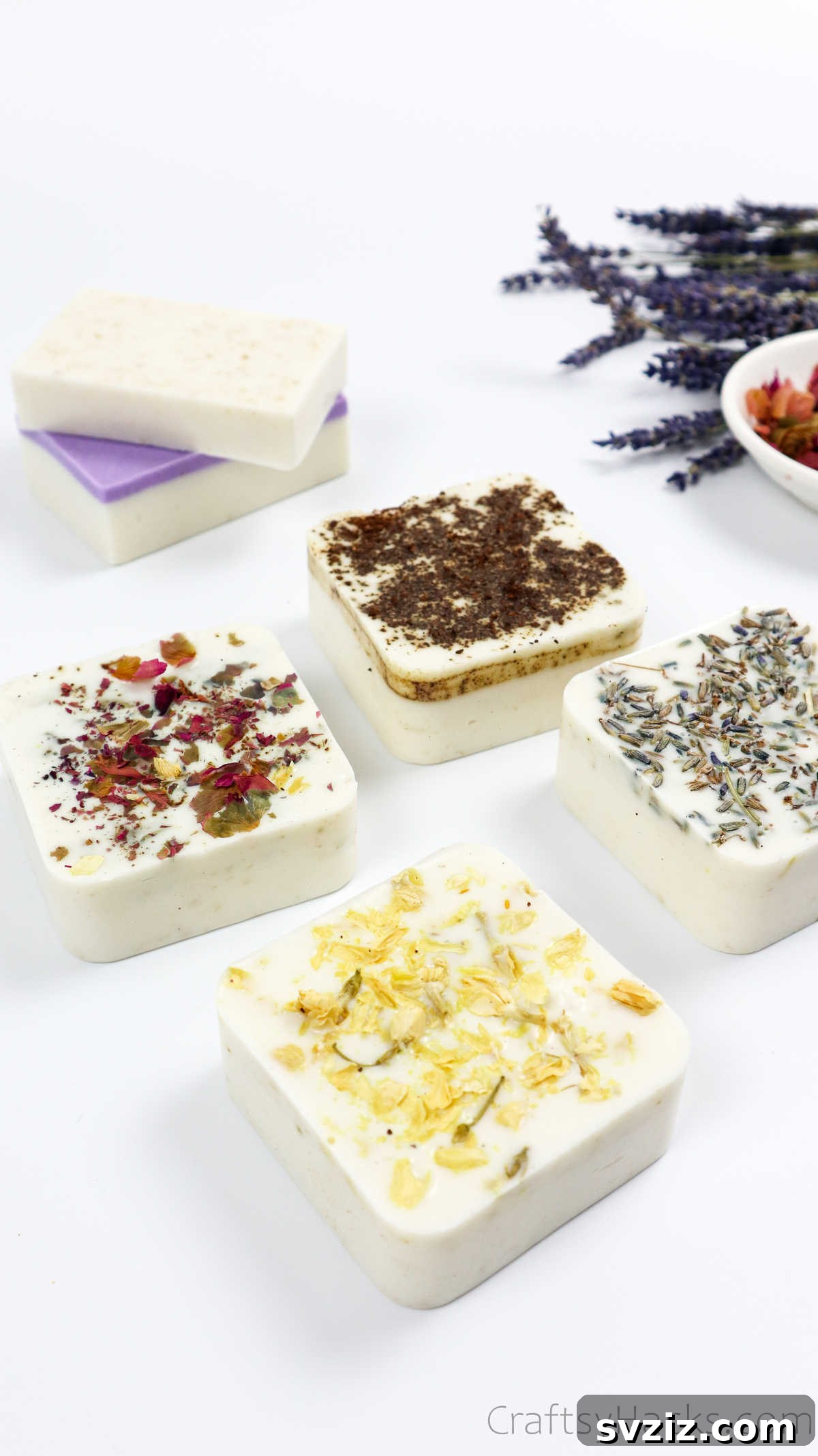 Your Guide to Crafting Homemade Soap 38 Four handmade soap bars decorated with dried flowers and herbs