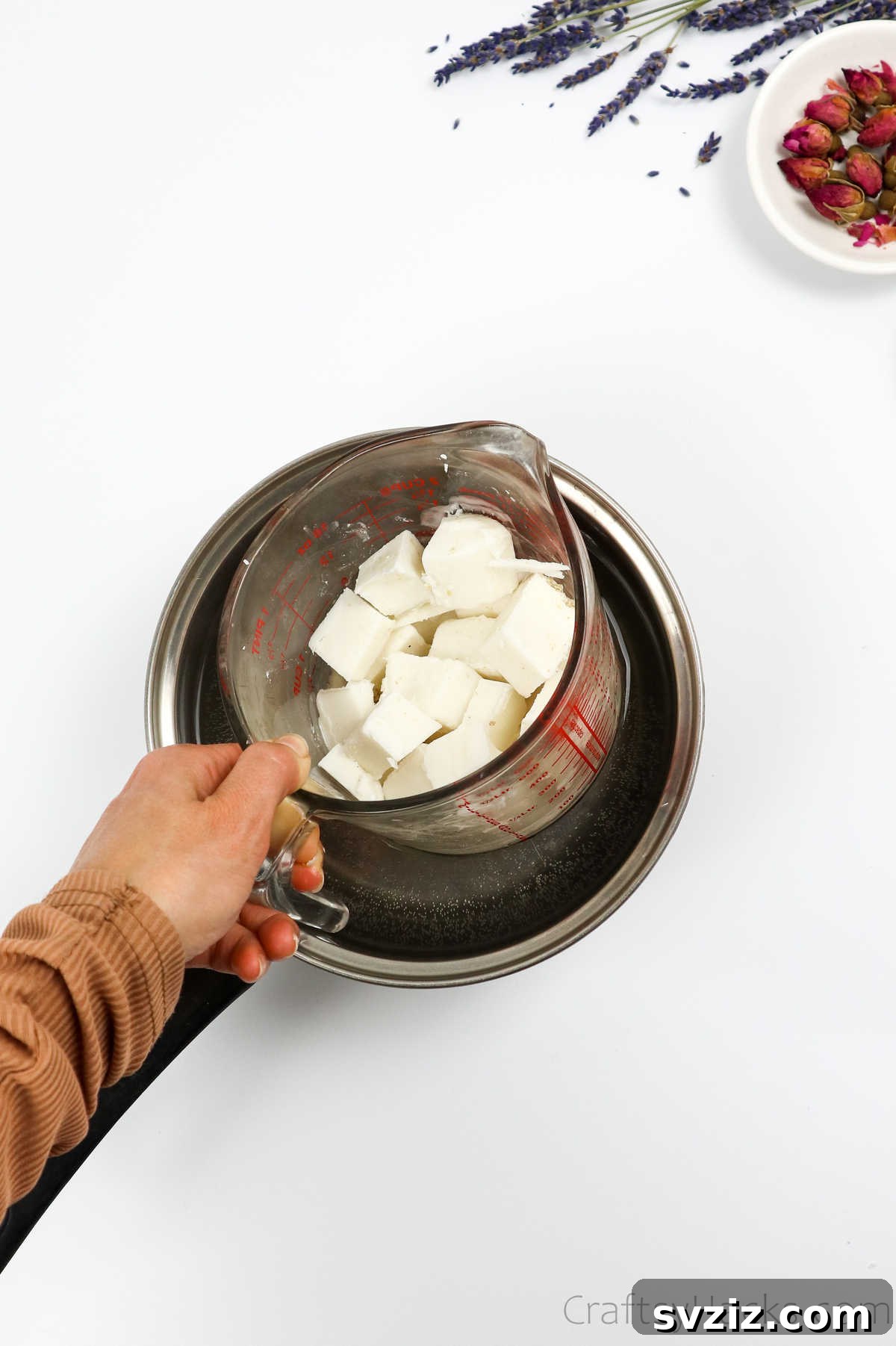 Your Guide to Crafting Homemade Soap 10 Melting soap base in a glass measuring cup using a double boiler method