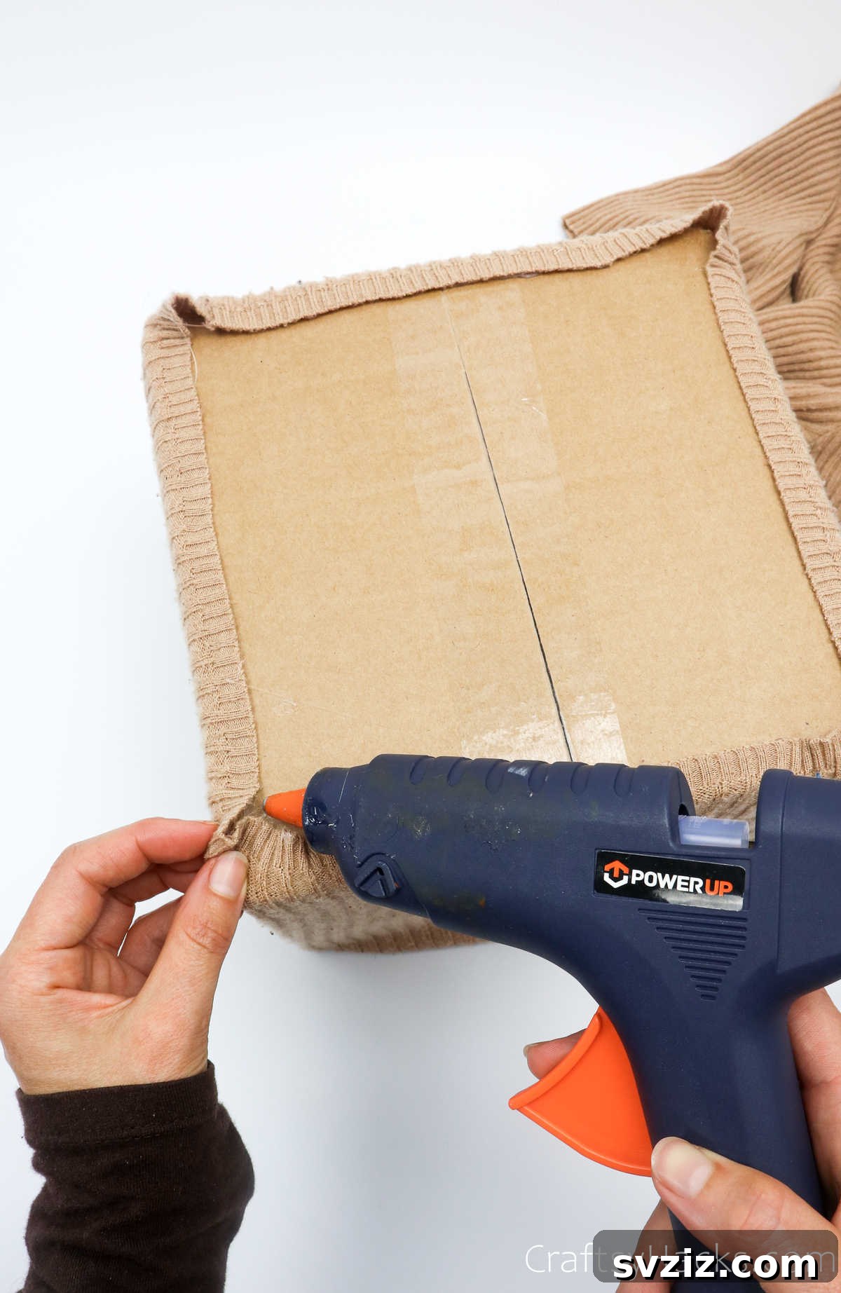 Securing a sweater corner with hot glue