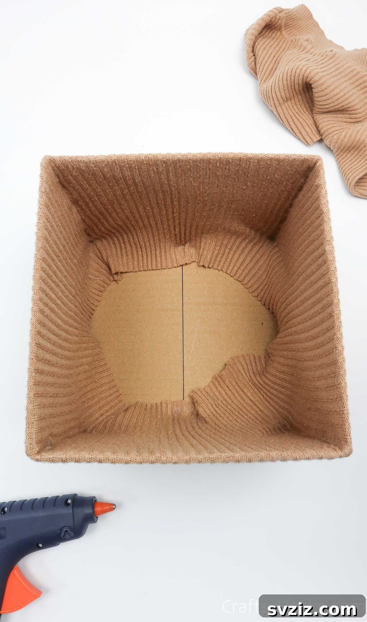 All inner corners of the box neatly glued down with sweater fabric