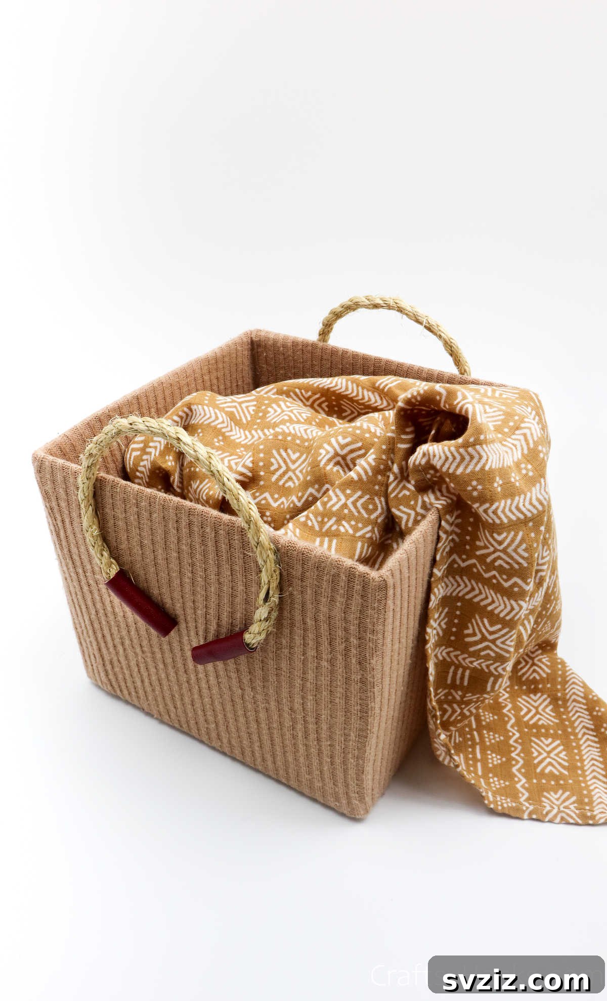 Stylish storage box holding a soft blanket