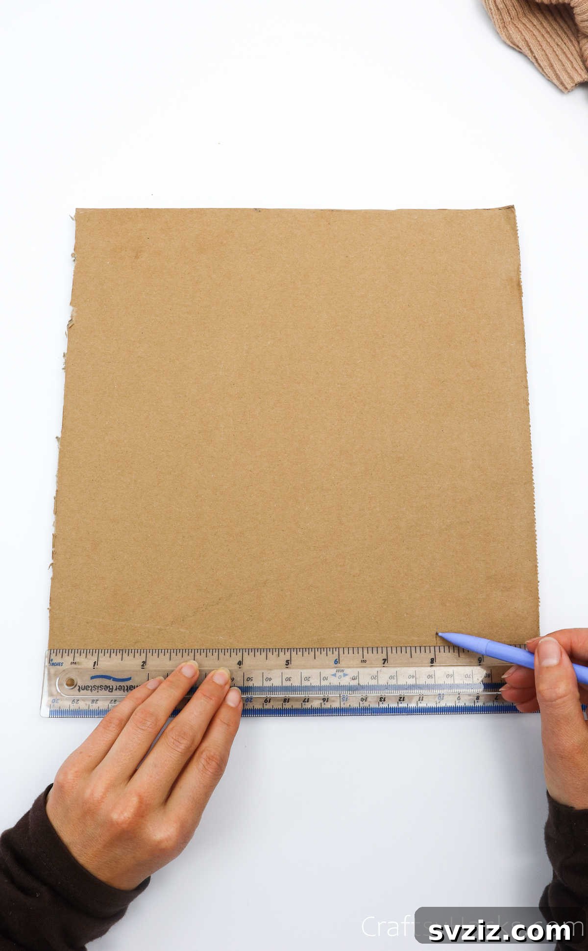 Marking measurements on a cardboard sheet