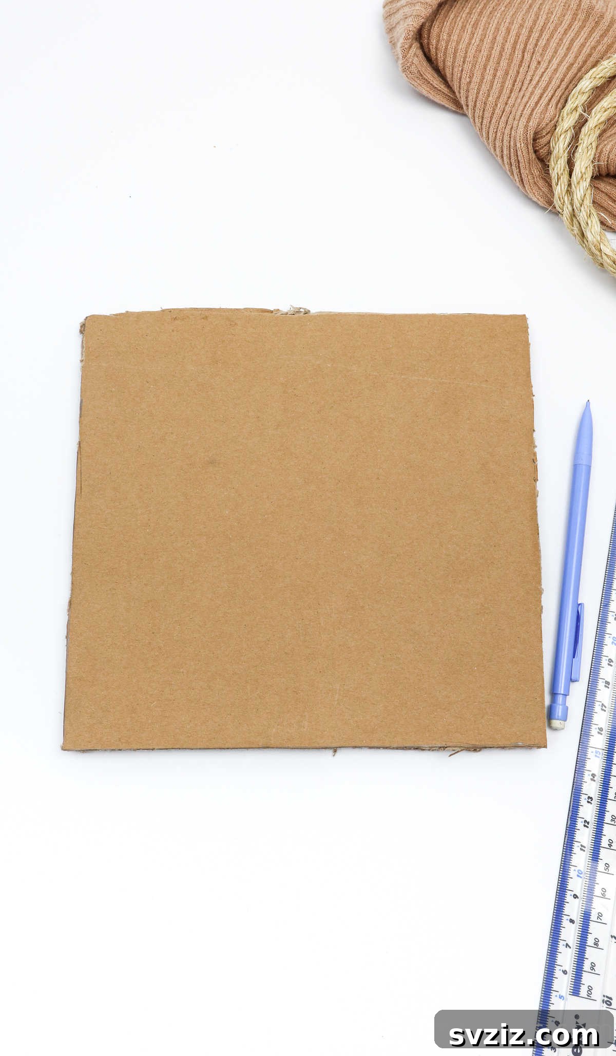 A freshly cut cardboard square for the box base